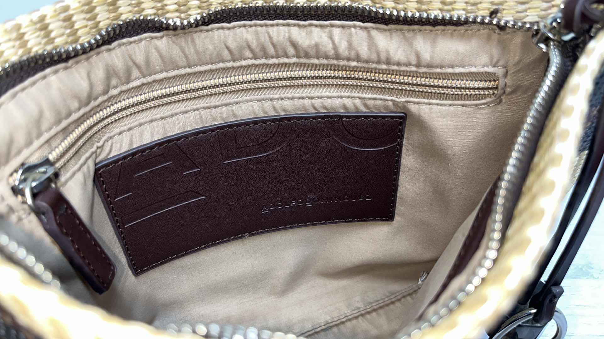 Photo 1 of ADOLFO DOMINGUEZ NATURAL RAFFIA-STYLE CLUTCH PURSE W ORNAMENTAL BAG CHARMS 10.75” X 1” H7.75”