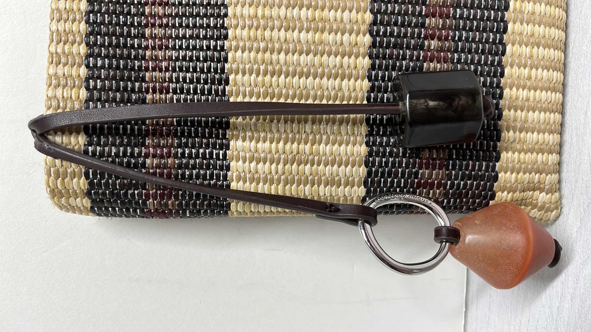 Photo 1 of ADOLFO DOMINGUEZ NATURAL RAFFIA-STYLE CLUTCH PURSE W ORNAMENTAL BAG CHARMS 10.75” X 1” H7.75”