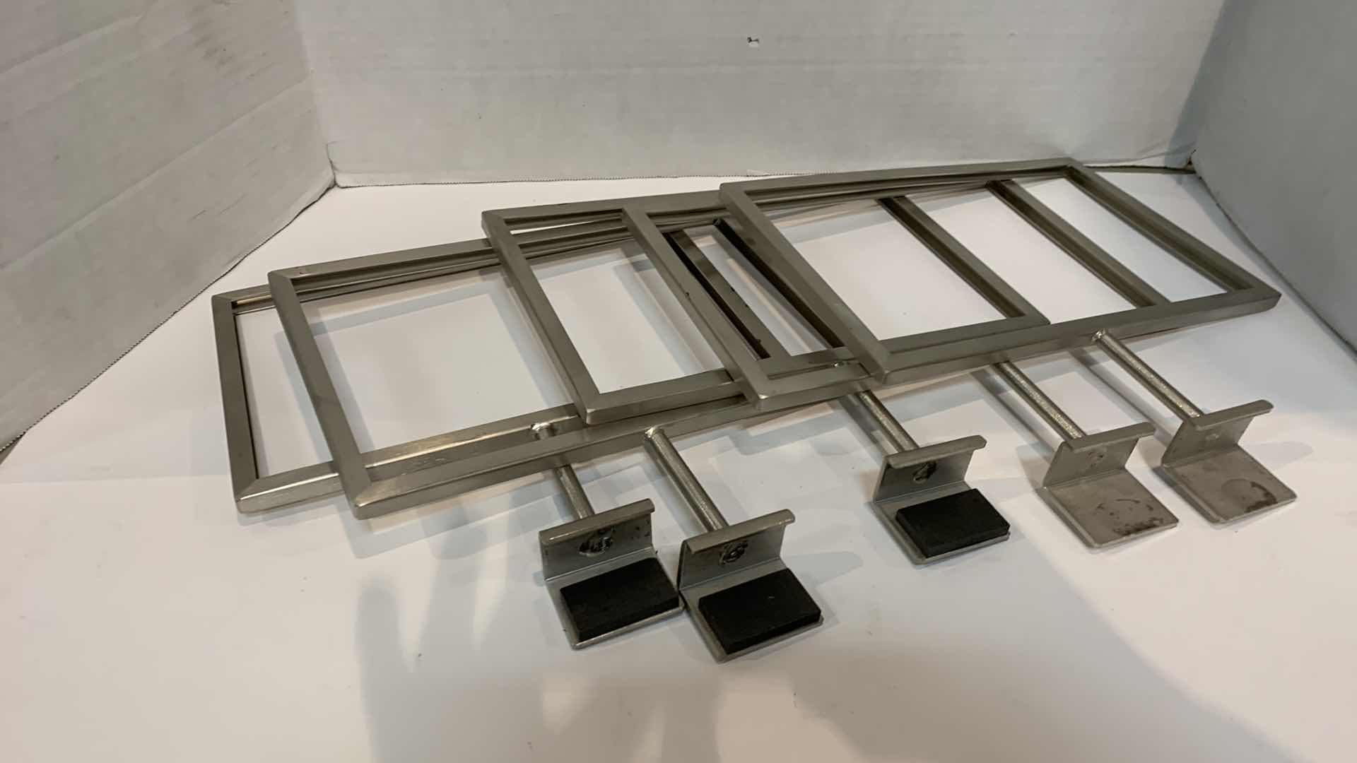 Photo 1 of FIVE METAL RETAIL SIGNS FOR FIXTURE TOP 10” X 11”