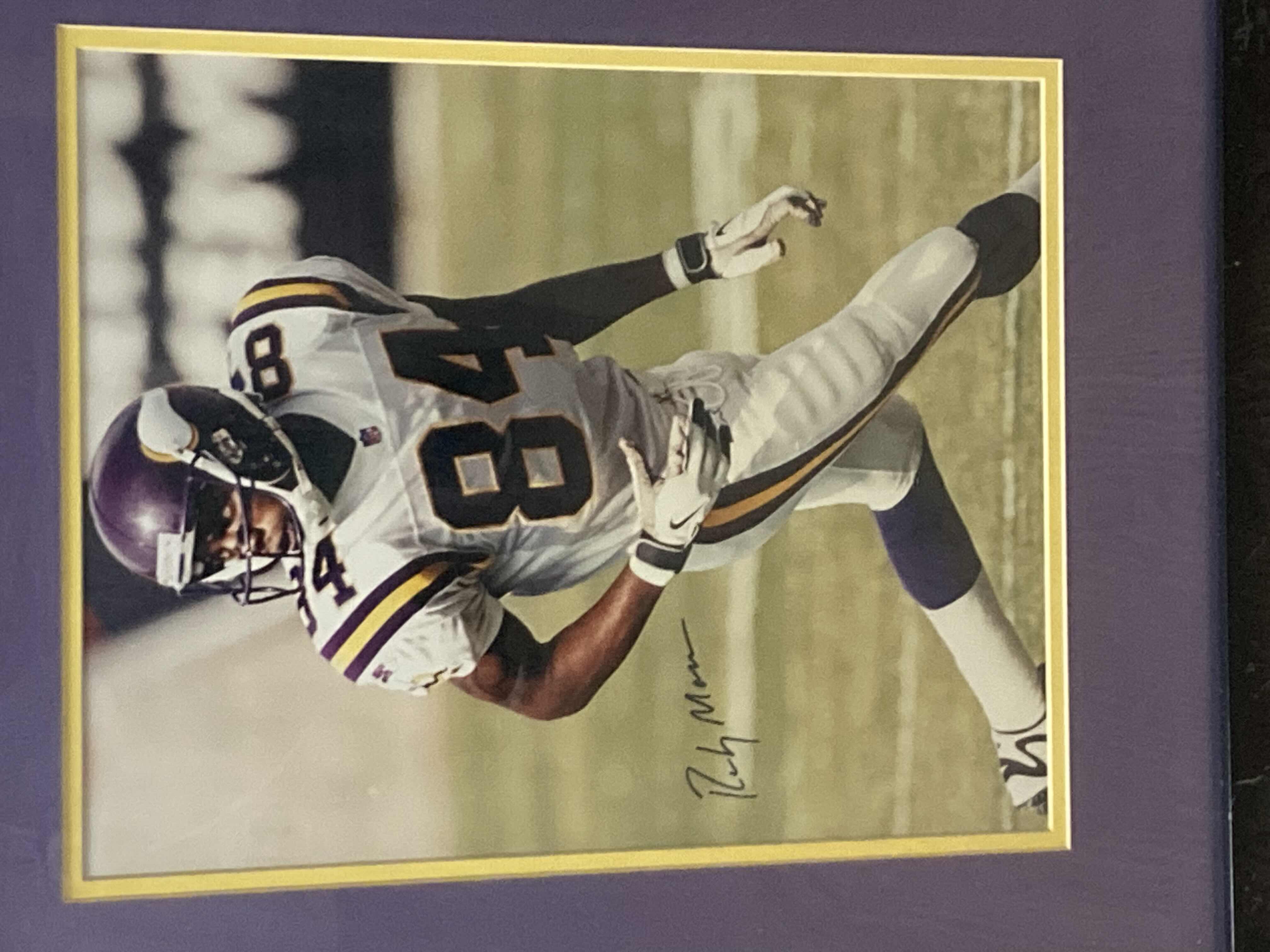 Photo 1 of RANDY MOSS VIKINGS #84 NFL FOOTBALL FRAMED PHOTOGRAPH AUTOGRAPHED BY RANDY MOSS NO COA 19.25” X 22.75”