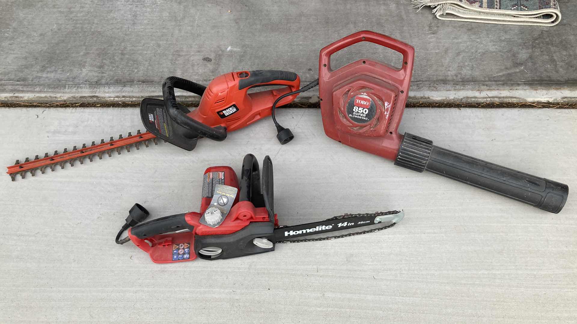 Photo 1 of BLACK & DECKER ELECTRIC HEDGE TRMMER, TORO ELECTRIC BLOWER W HOMELITE GAS CHAINSAW