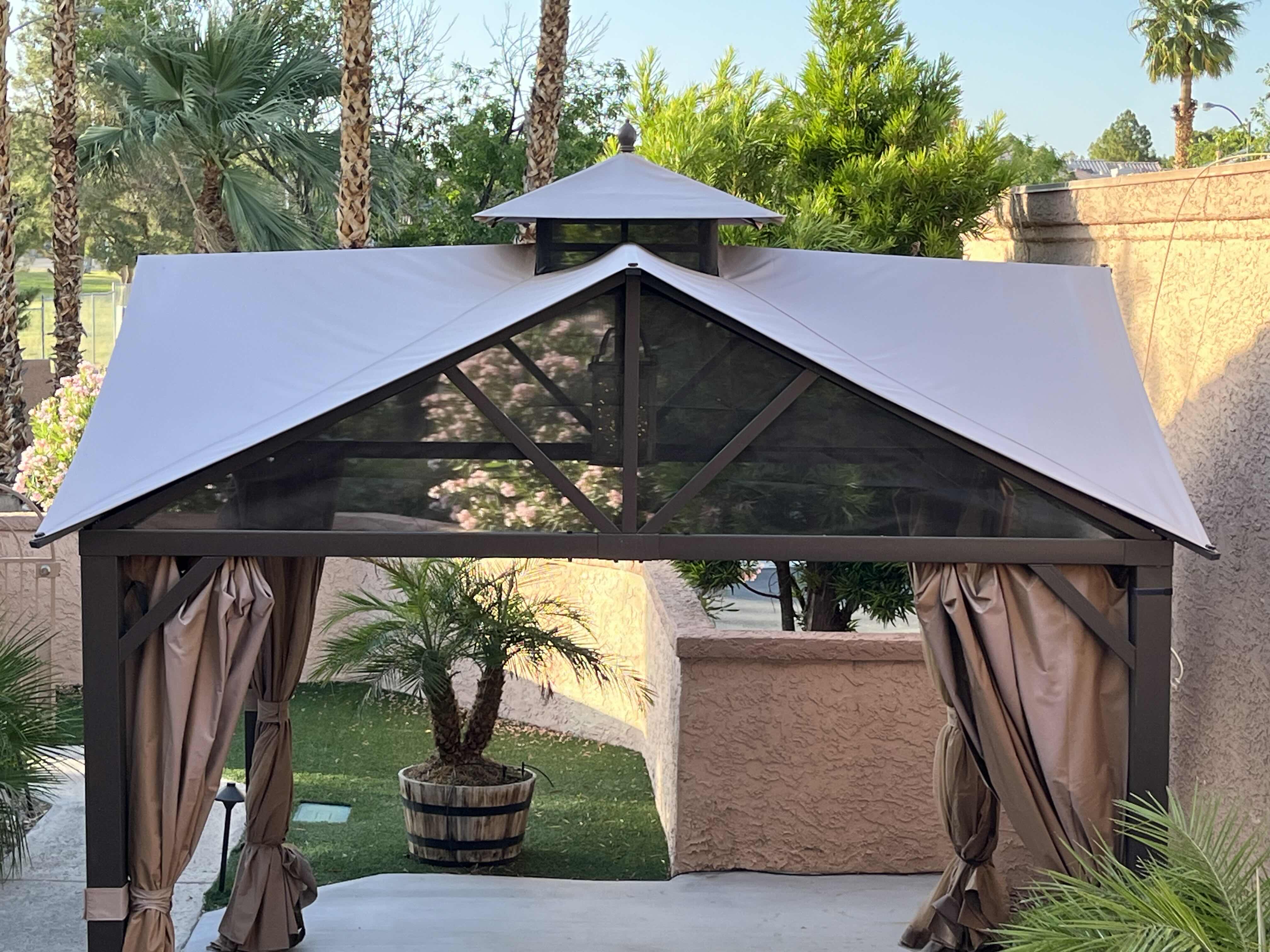 Photo 1 of BLACK STEEL FRAMED GAZEBO PATIO TENT W PRIVACY CURTAINS 124” X 122.5” H132” (READ NOTES)