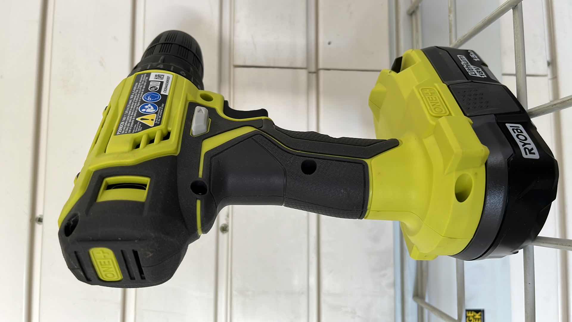 Photo 1 of RYOBI ONE PLUS LITHIUM 18V 1.5AH CORDLESS DRILL W BATTERY MODEL P209DCN