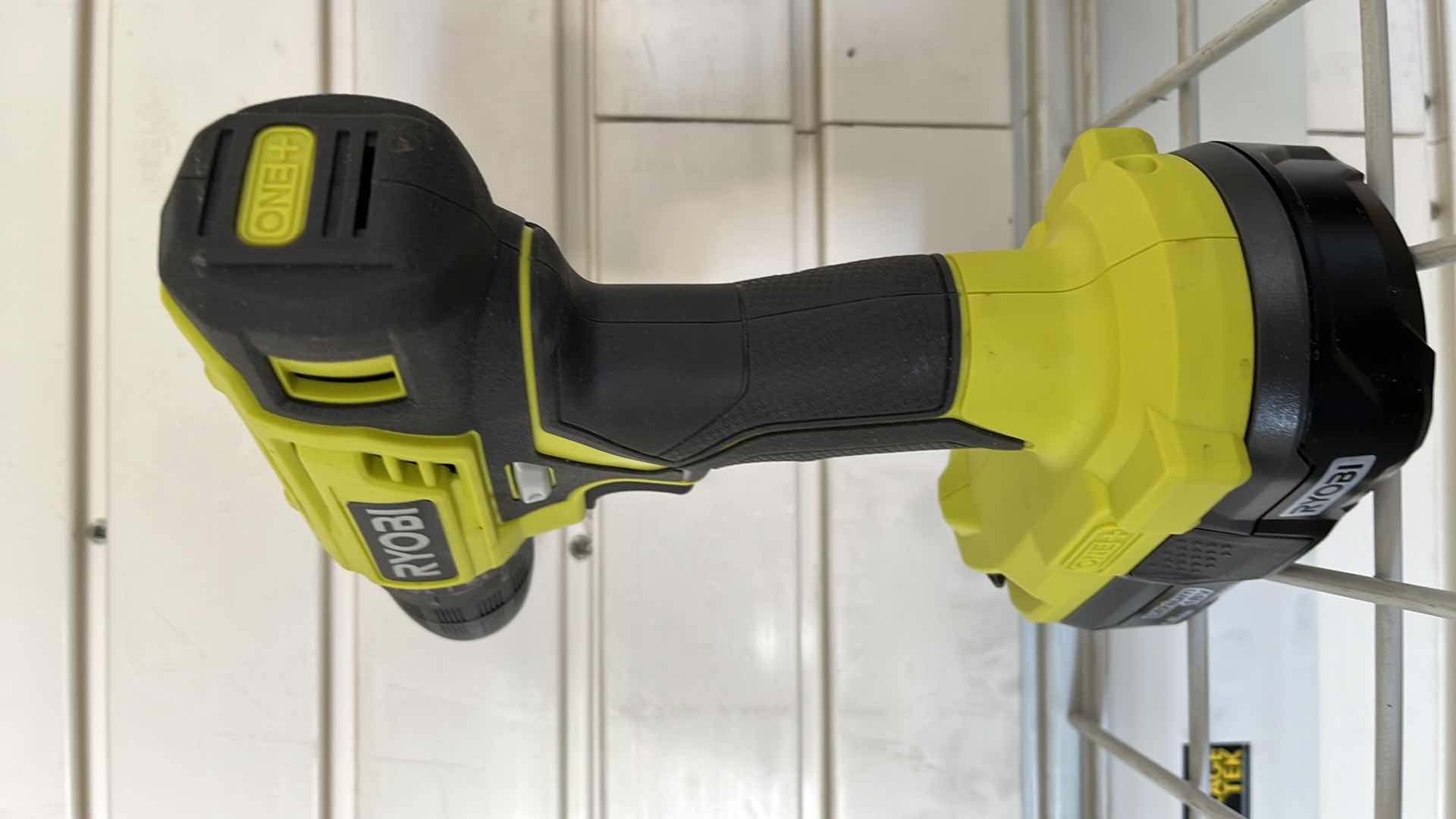 Photo 2 of RYOBI ONE PLUS LITHIUM 18V 1.5AH CORDLESS DRILL W BATTERY MODEL P209DCN