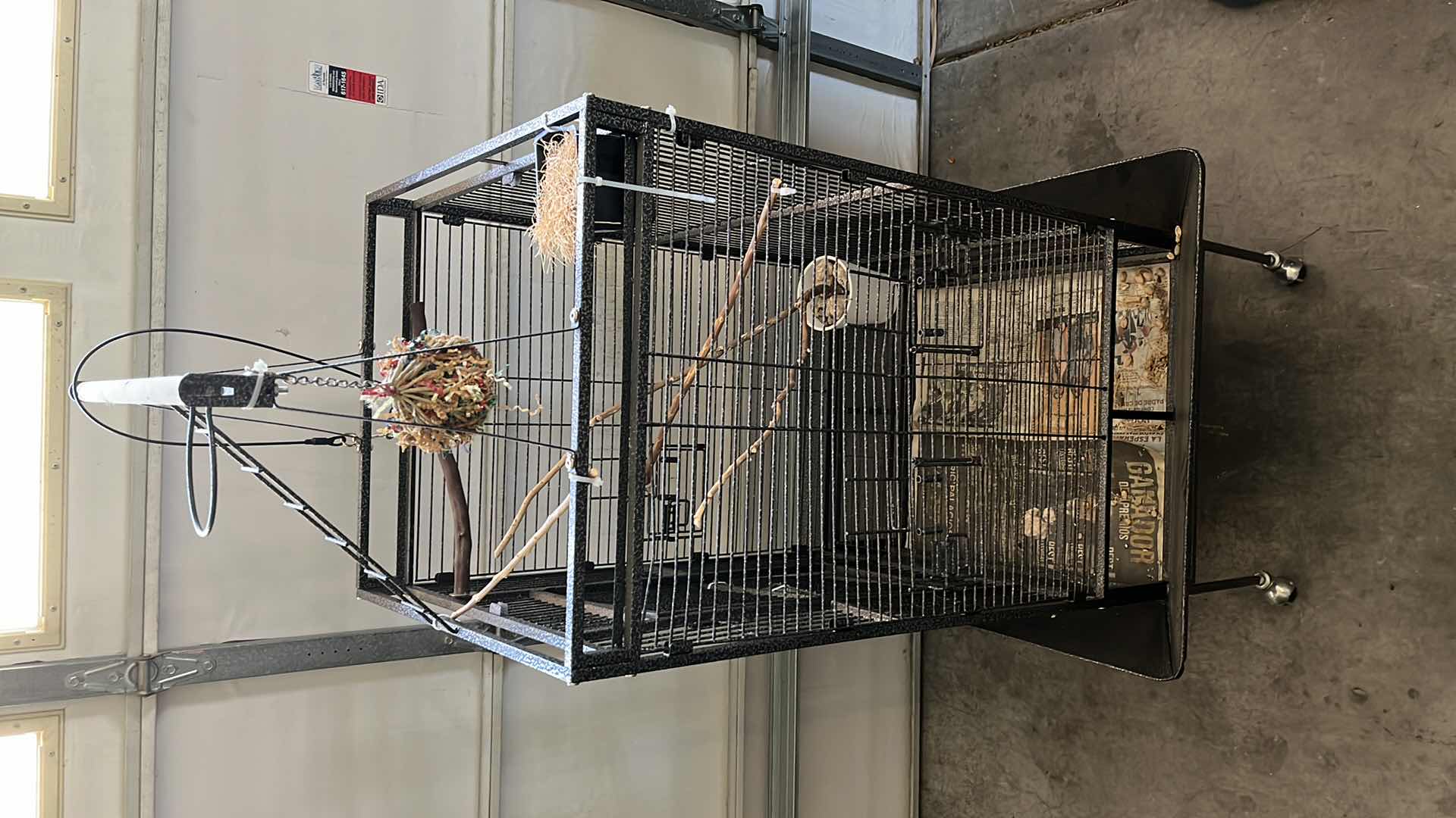 Photo 1 of BLACK GALVANIZED STEEL FINISH ROLLING METAL BIRD CAGE W ACCESSORIES 32” X 30” H70”