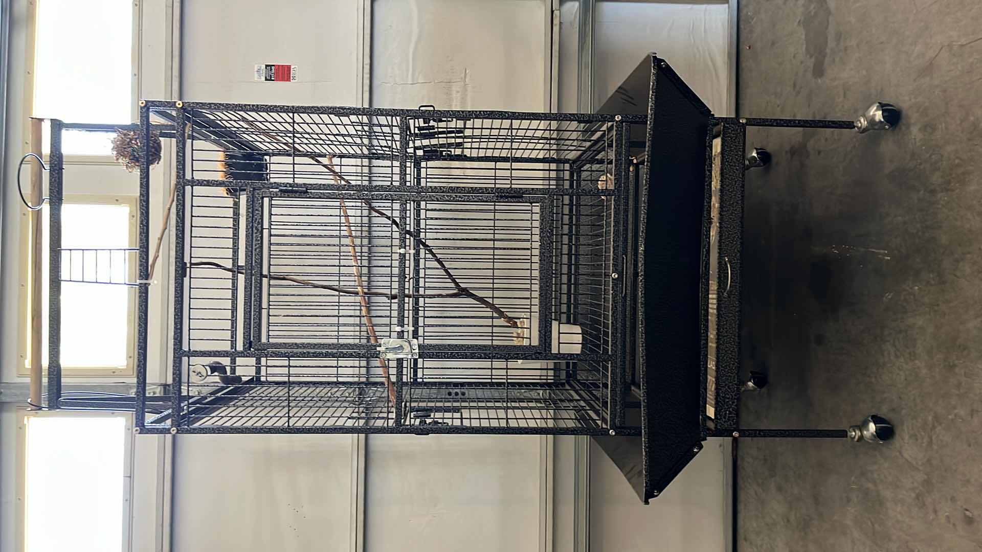 Photo 1 of BLACK GALVANIZED STEEL FINISH ROLLING METAL BIRD CAGE W ACCESSORIES 32” X 30” H70”