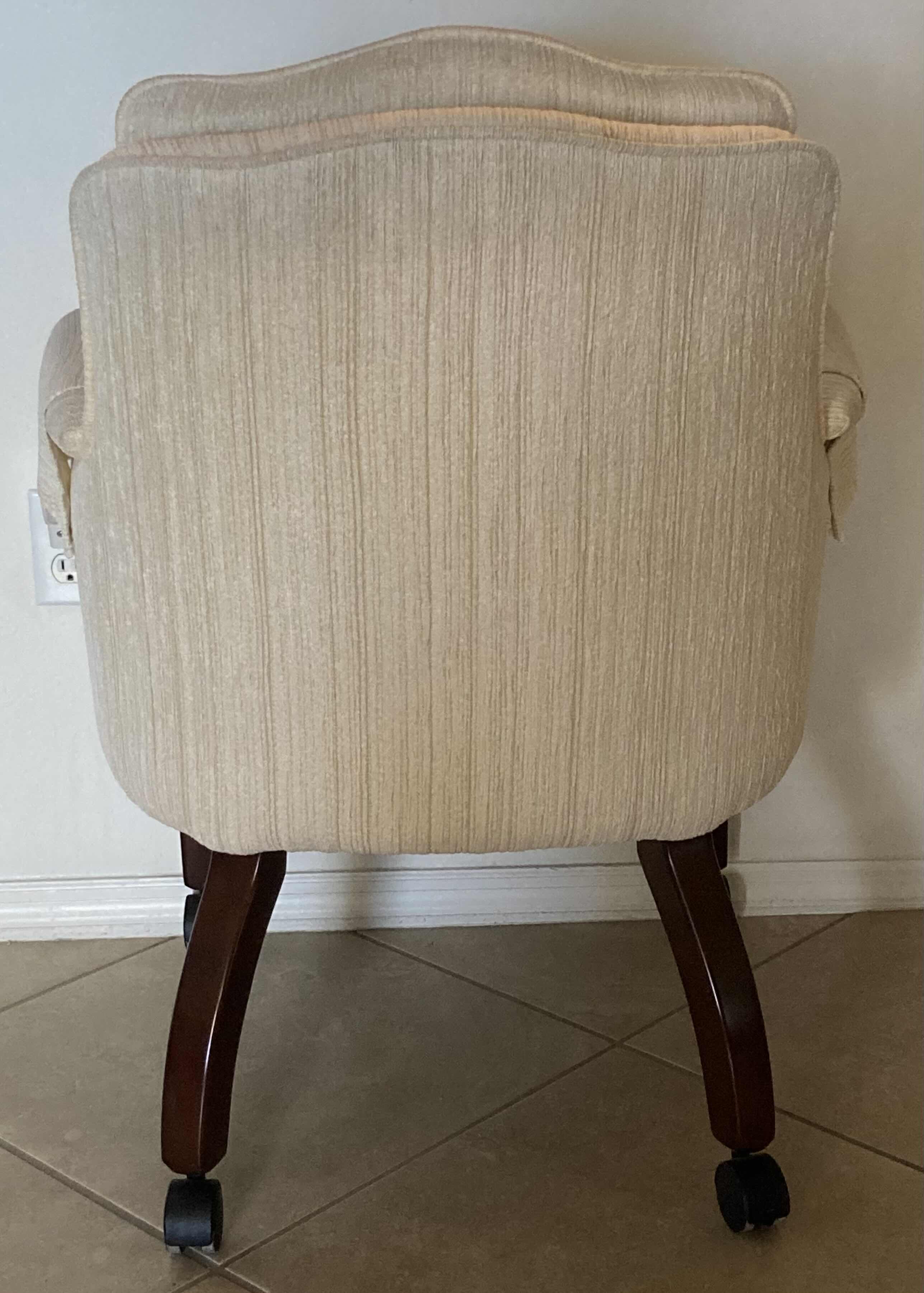 Photo 1 of BEIGE UPHOLSTERY SWIVEL CHAIR 24” X 24” H34”