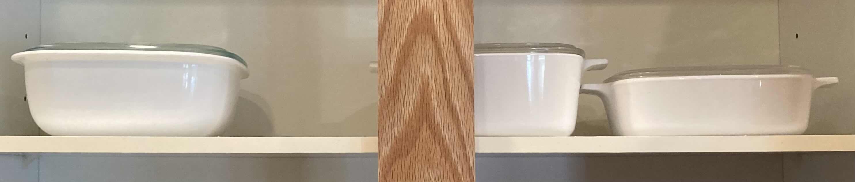 Photo 1 of CONTENTS OF CABINET- BAKING PANS VARIOUS STYLES/SIZES & MEASURING CUPS