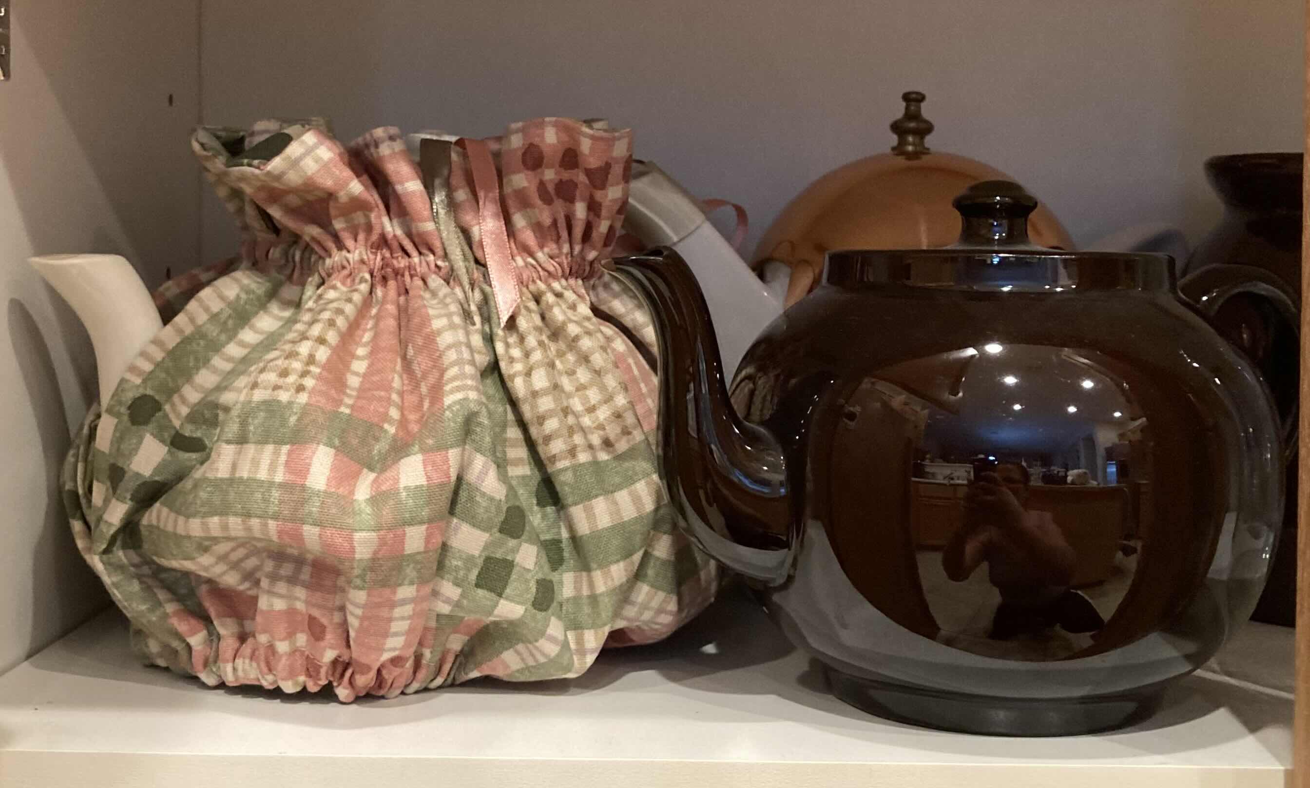 Photo 1 of CONTENTS OF CABINET- TEA POTS, PITCHERS & SALT/PEPPER SHAKER