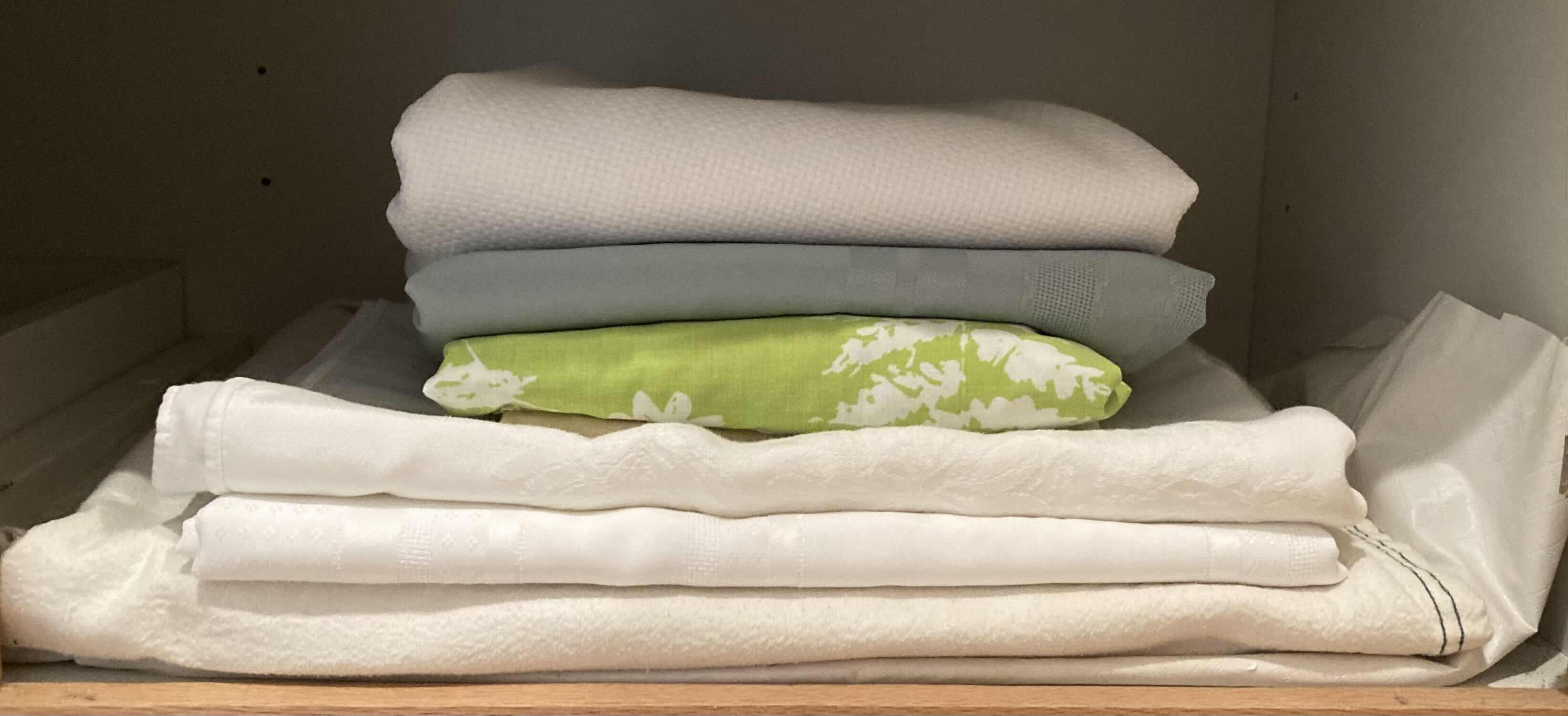 Photo 1 of CONTENTS OF CABINET- KITCHEN & BATHROOM LINENS