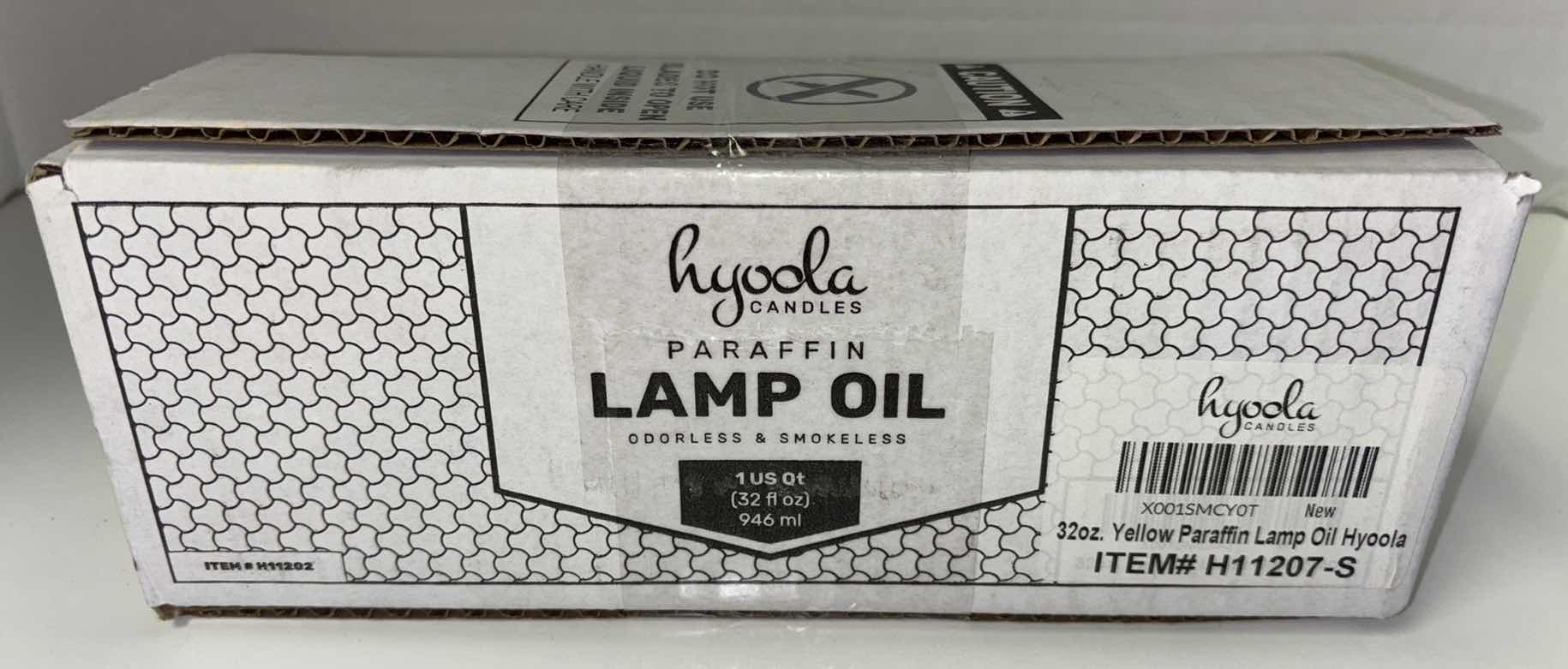 Photo 1 of NEW HYOOLA CANDLES 32 OZ YELLOW PARAFFIN INDOOR/OUTDOOR LAMP OIL, ODORLESS & SMOKELESS