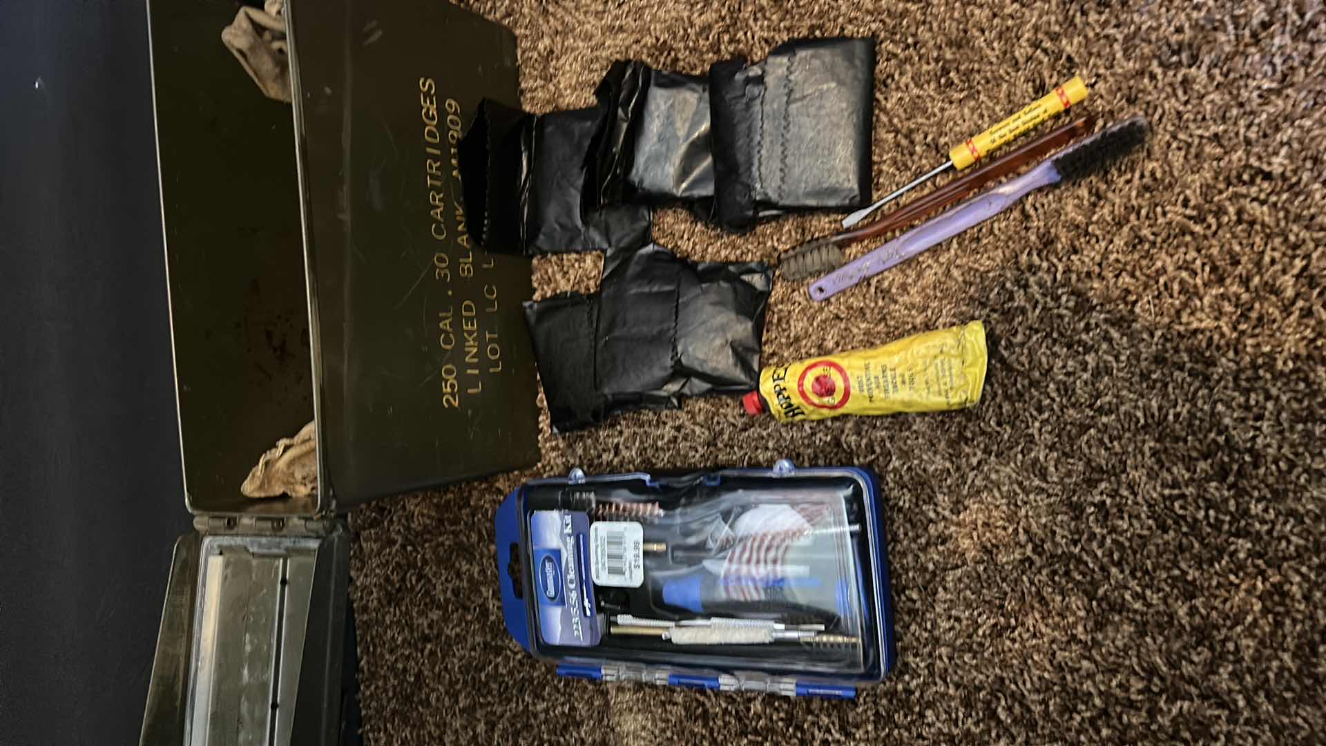 Photo 1 of GUN CLEANING KIT IN MILITARY GREEN METAL AMMUNITION CASE