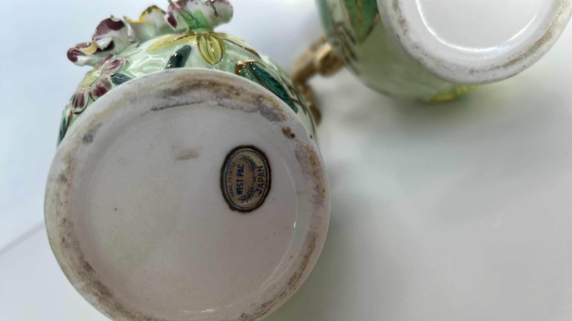 Photo 1 of TWO VINTAGE HANDPAINTED PORCELAIN PITCHERS/ VASES H 8 1/2”