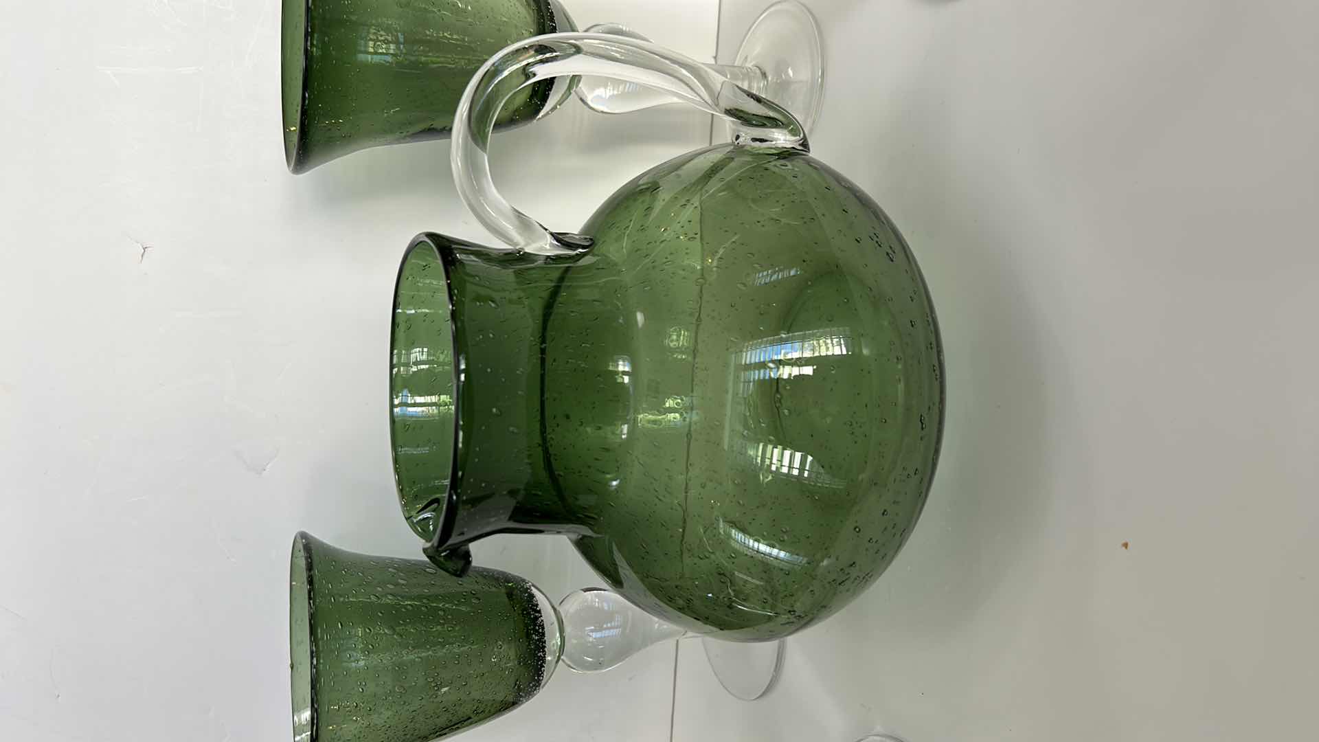 Photo 1 of GREEN SPECKLED GLASS PITCHER WITH 4 STEMMED GLASSES