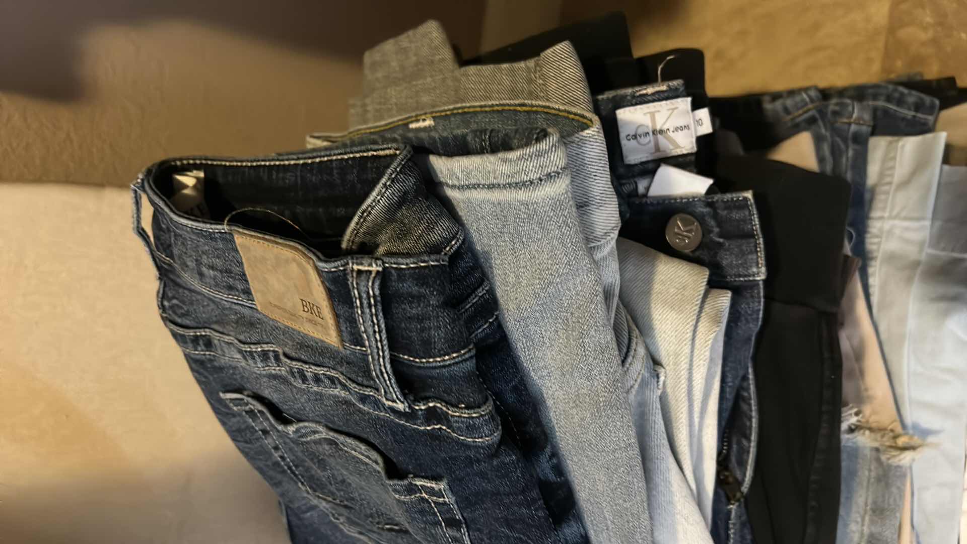 Photo 1 of LARGE STACK OF WOMENS PANTS MOSTLY SIZE 8