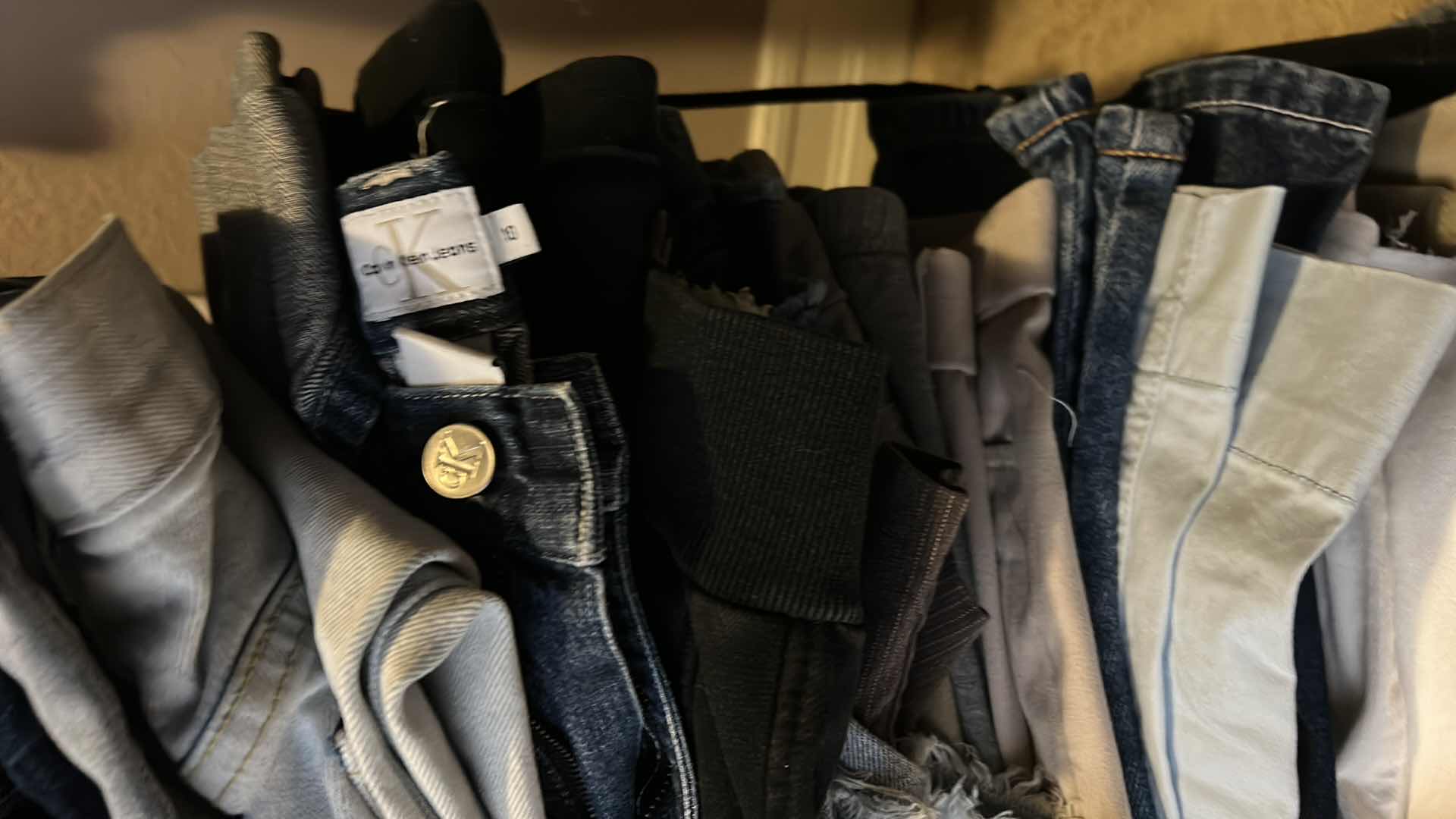 Photo 1 of LARGE STACK OF WOMENS PANTS MOSTLY SIZE 8