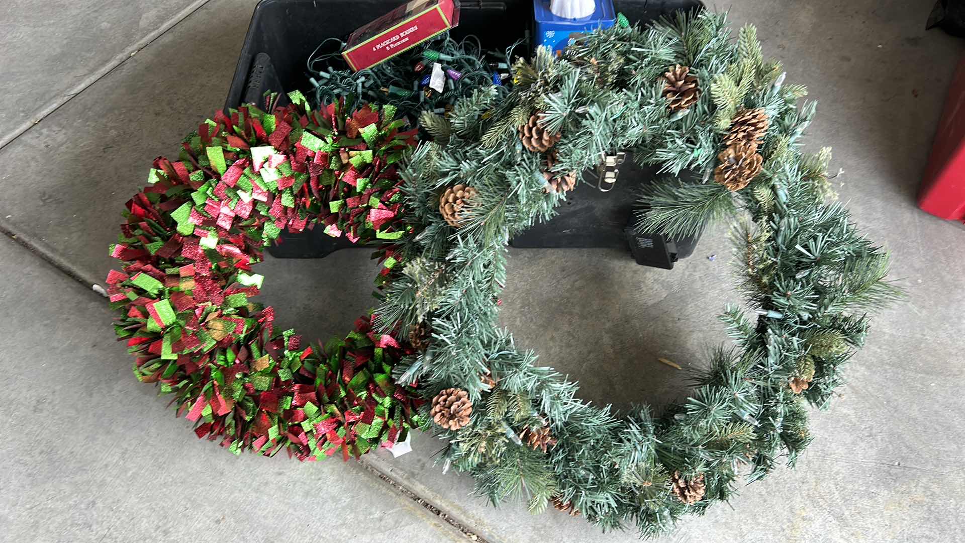 Photo 1 of TOTE FULL OF CHRISTMAS LIGHTS, AND TWO WREATHS