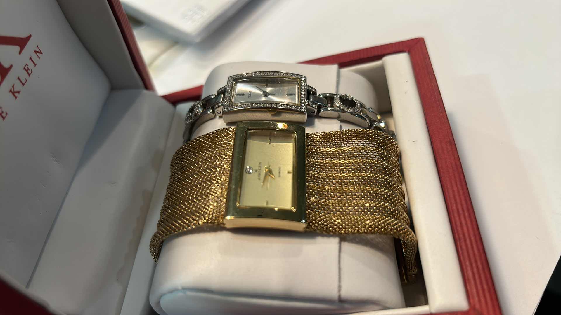 Photo 1 of TWO WOMENS WATCHES- GOLD ANNE KLEIN AND SILVER GUESS (NEEDS BATTERIES)