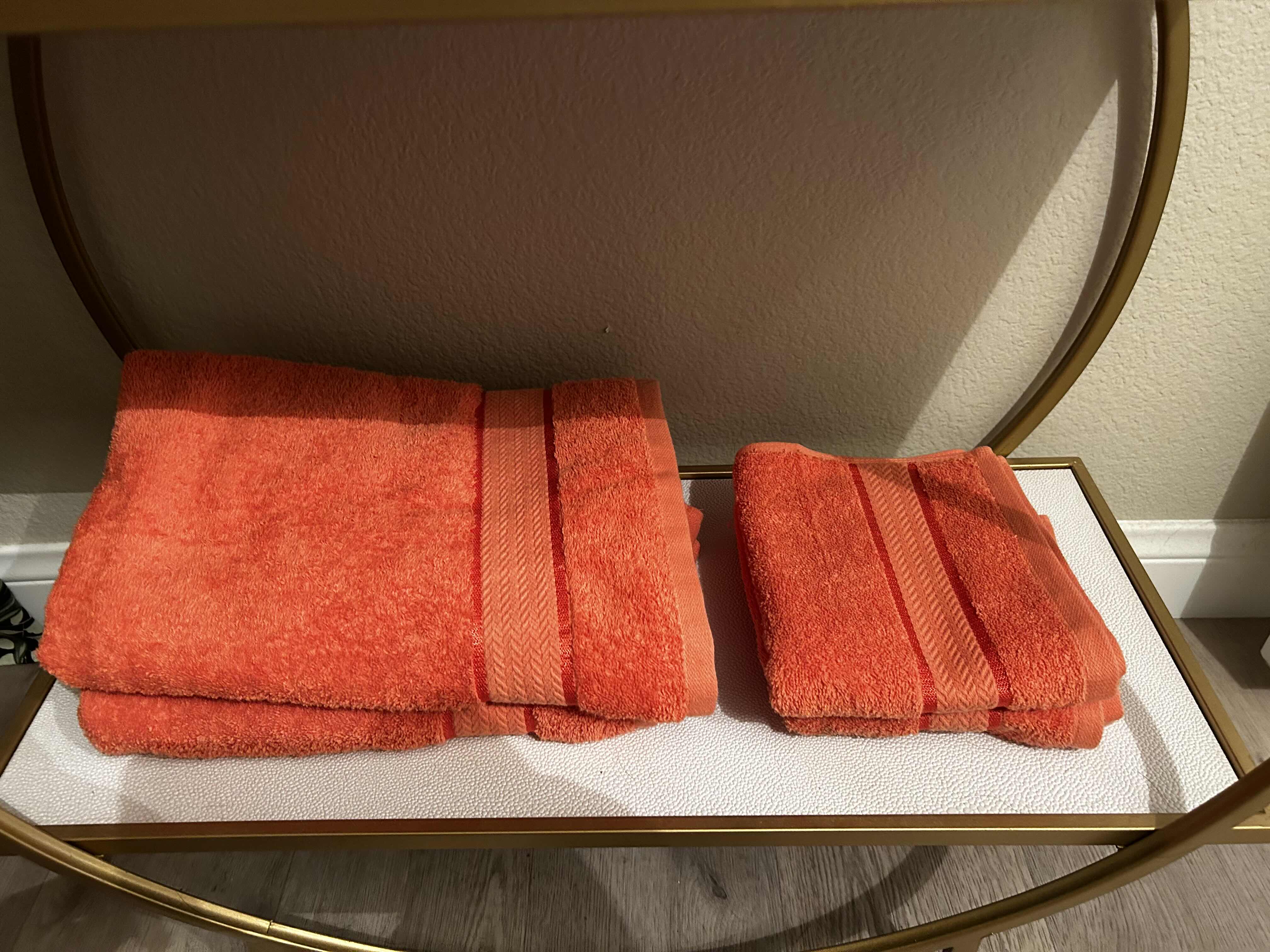 Photo 1 of BATHROOM ENSEMBLE INCLUDES- DRAPERY PANELS, 2 ARTWORK, ORANGE VASE AND GOLD HAMMERED MIRROR ON STAND, 2 BLACK AND WHITE TALL JARS WITH LIDS AND BLUE GLASS VASE (CART NOT INCLUDED) LARGEST FRAMED ARTWORK 3’ x 46”