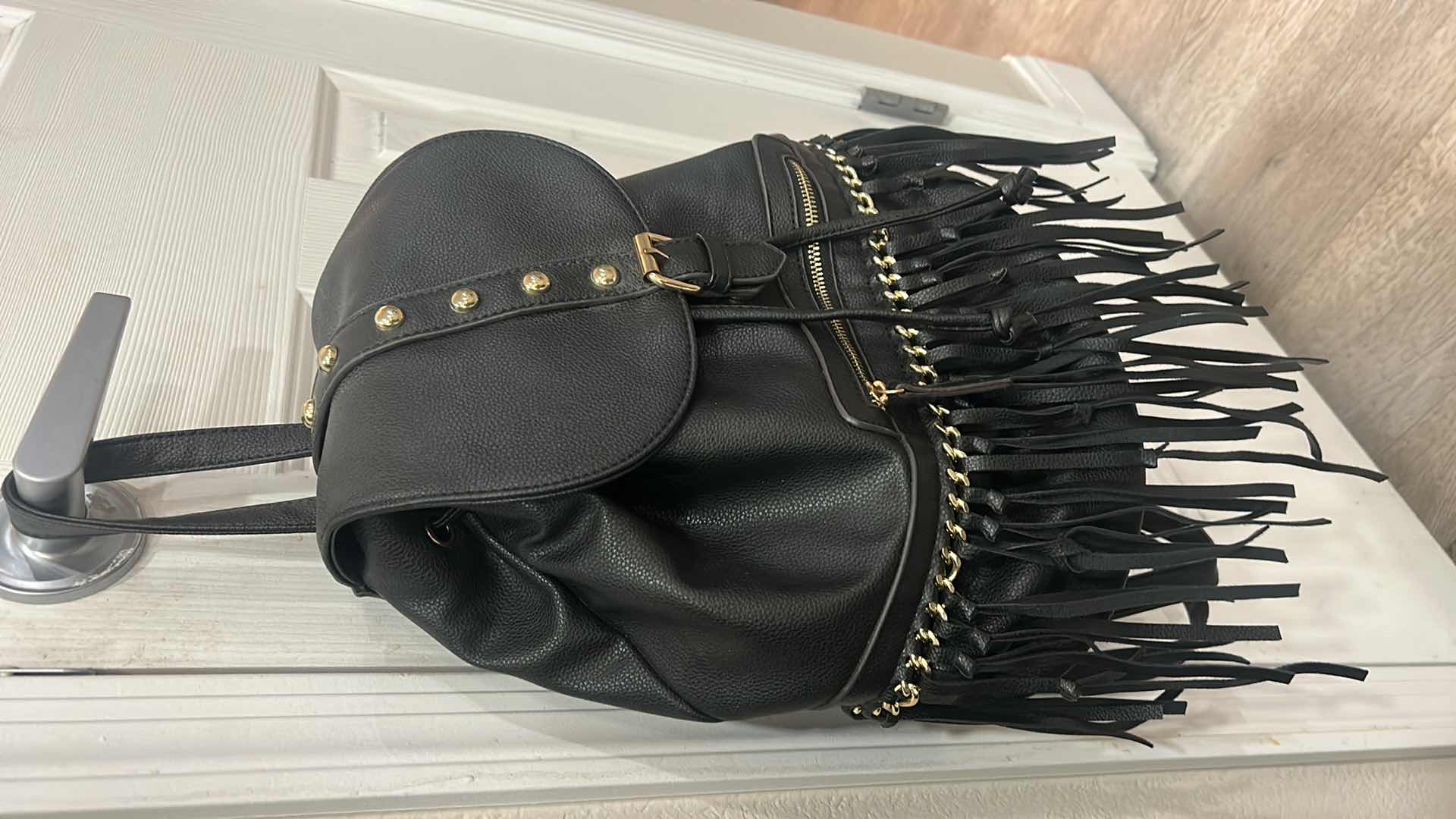 Photo 1 of BLACK BACKPACK PURSE WITH GOLD ACCENTS
