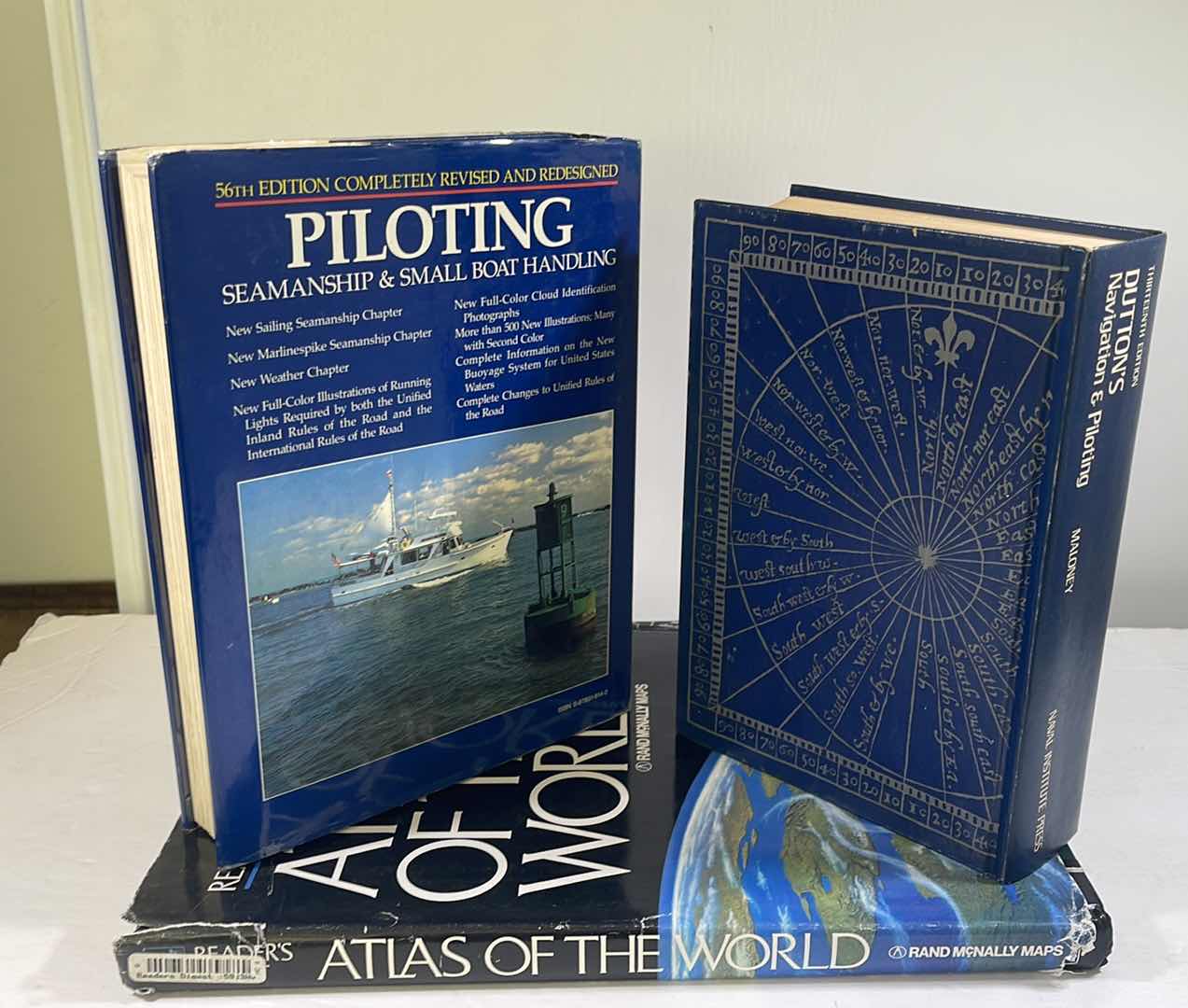 Photo 1 of NAVIGATION & PILOTING BOOKS WITH WORLD ATLAS