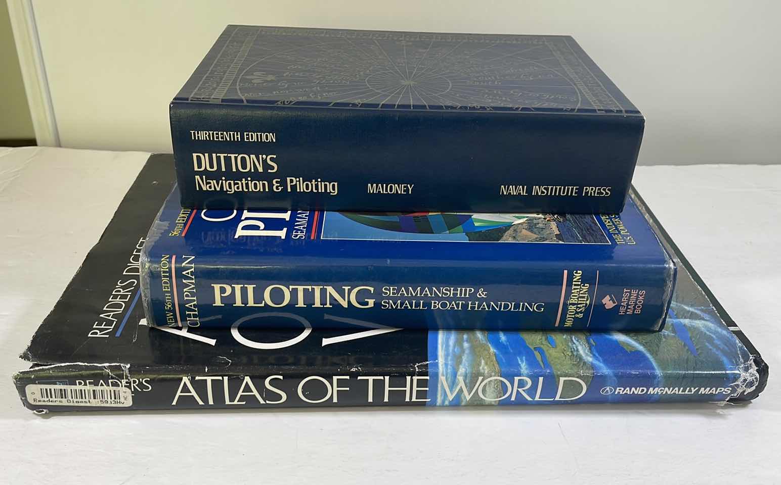 Photo 1 of NAVIGATION & PILOTING BOOKS WITH WORLD ATLAS