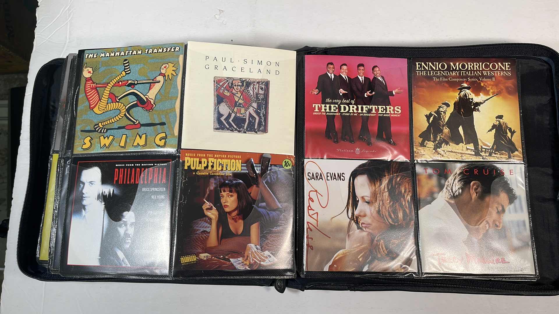 Photo 1 of ASSORTED MUSIC CDS & BODY GLOVE CARRY CASE
