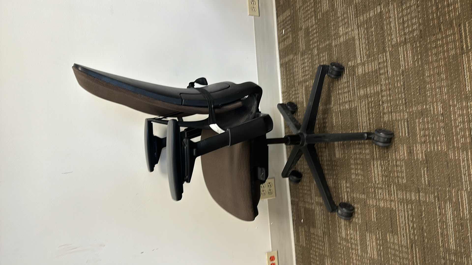 Photo 1 of BROWN SWIVEL AND ADJUSTABLE OFFICE CHAIR