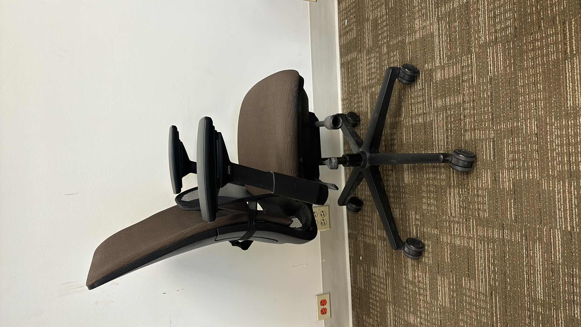 Photo 1 of BROWN SWIVEL AND ADJUSTABLE OFFICE CHAIR