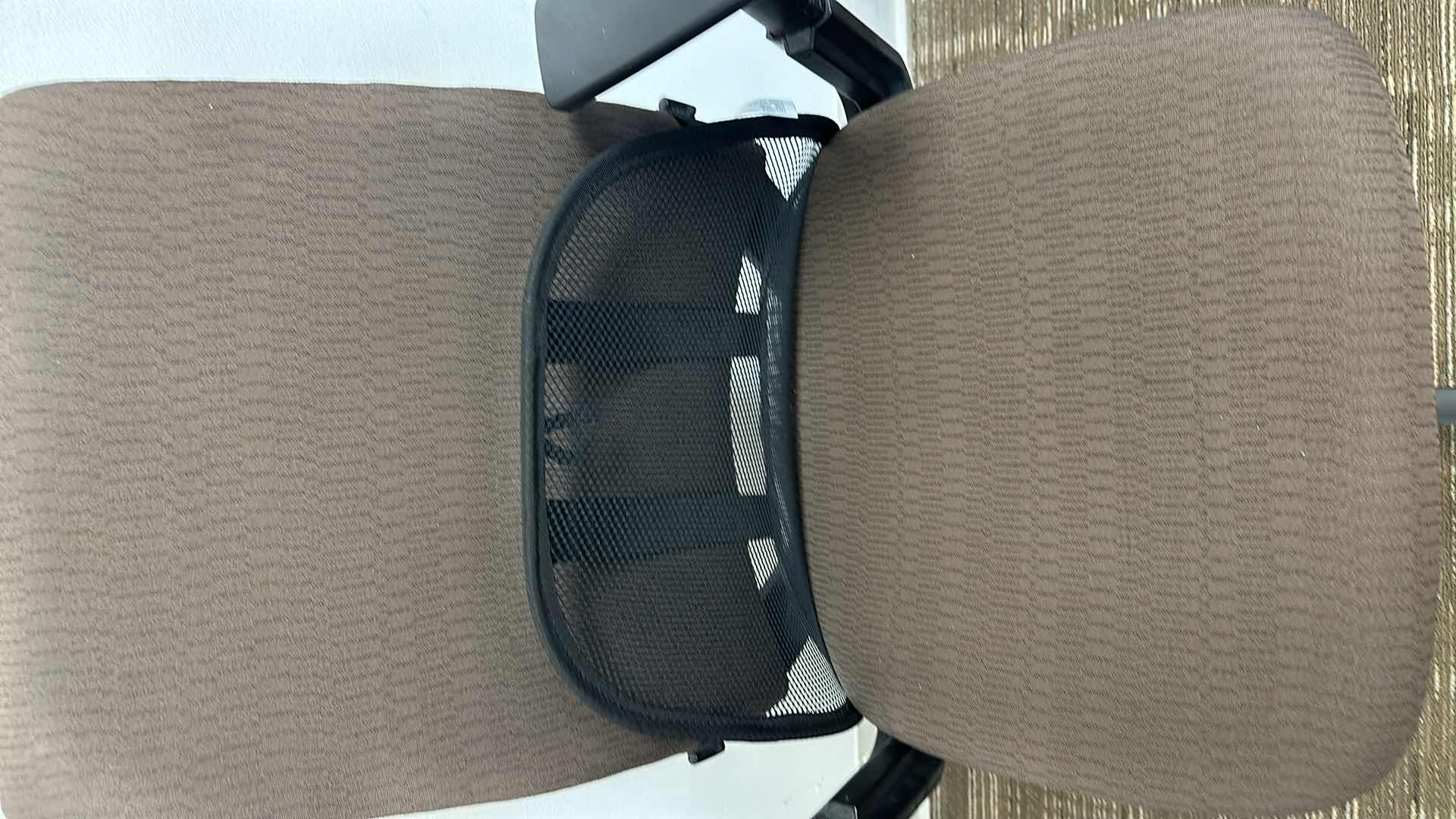 Photo 1 of BROWN SWIVEL AND ADJUSTABLE OFFICE CHAIR