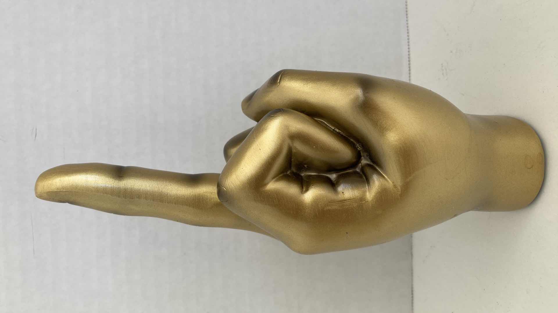 Photo 1 of GOLD FINISH MIDDLE FINGER HAND GESTURE RESIN STATUE H8.75”