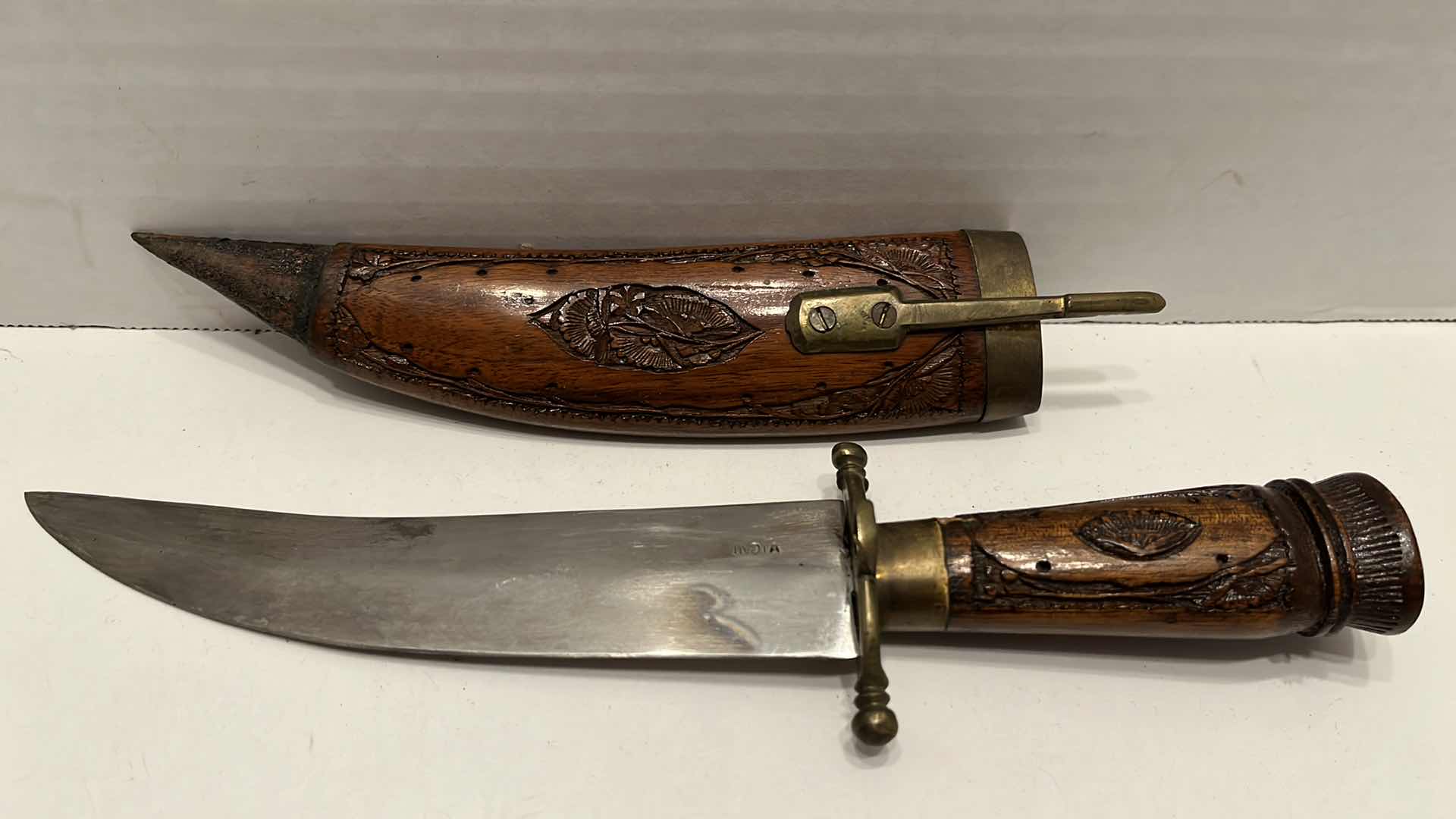 Photo 1 of INDIAN CARVED WOOD BRASS HANDLE FIXED CURVED BLADE KNIFE W WOOD CARVED SCABBARD 2.25” X 10.5”