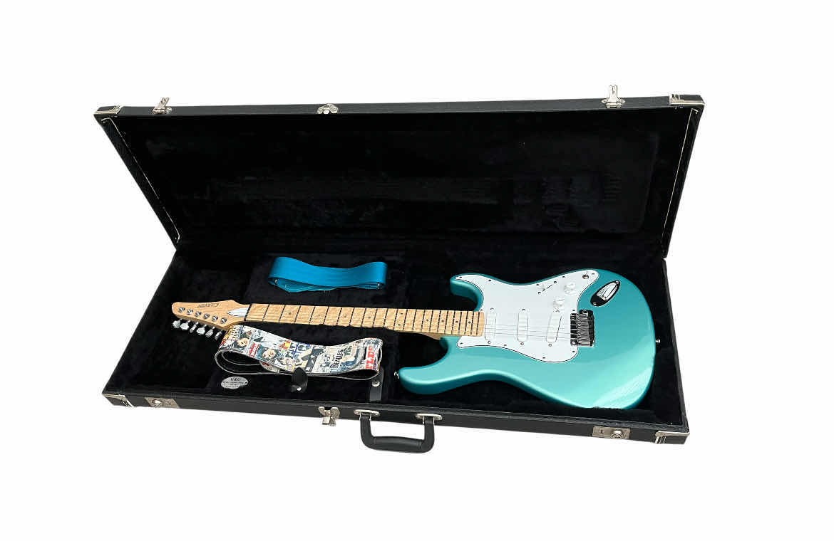 Photo 1 of CARVIN BOLT TEAL METALLIC MAPLE NECK ELECTRIC GUITAR W THE BEATLES/ TEAL STRAPS & CARVIN HARD CASE