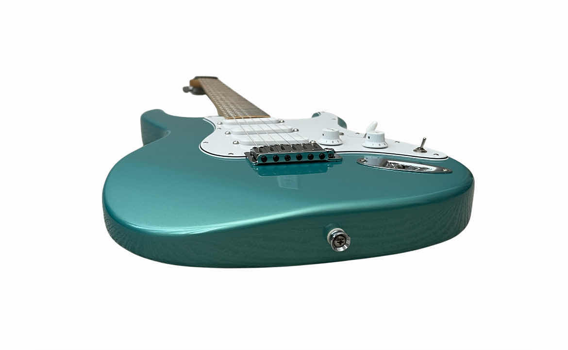 Photo 1 of CARVIN BOLT TEAL METALLIC MAPLE NECK ELECTRIC GUITAR W THE BEATLES/ TEAL STRAPS & CARVIN HARD CASE