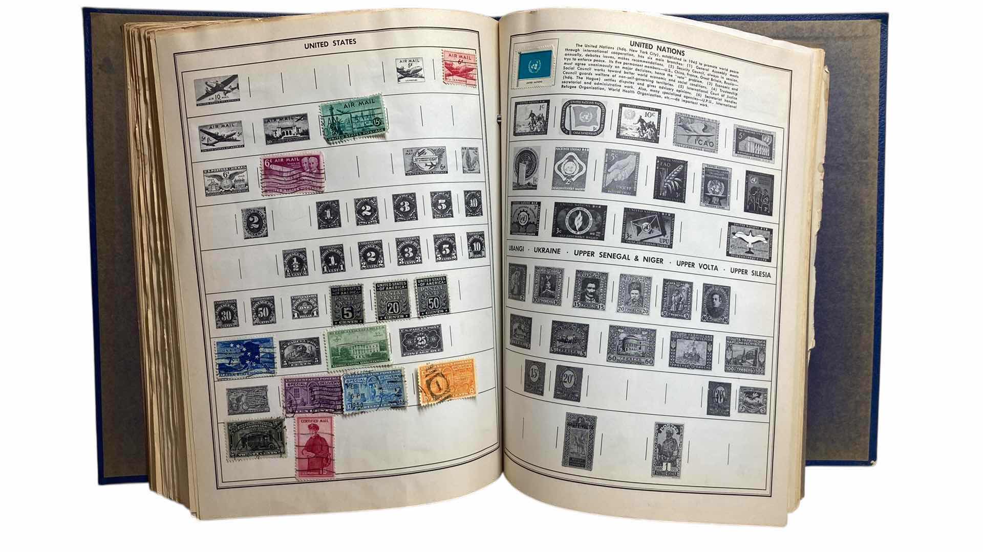 Photo 1 of THE AMBASSADOR ALBUM POSTAGE STAMPS OF THE WORLD BOOKLET PRINTED 1957 COPYRIGHT 1954 W STAMPS FROM AROUND THE WORLD