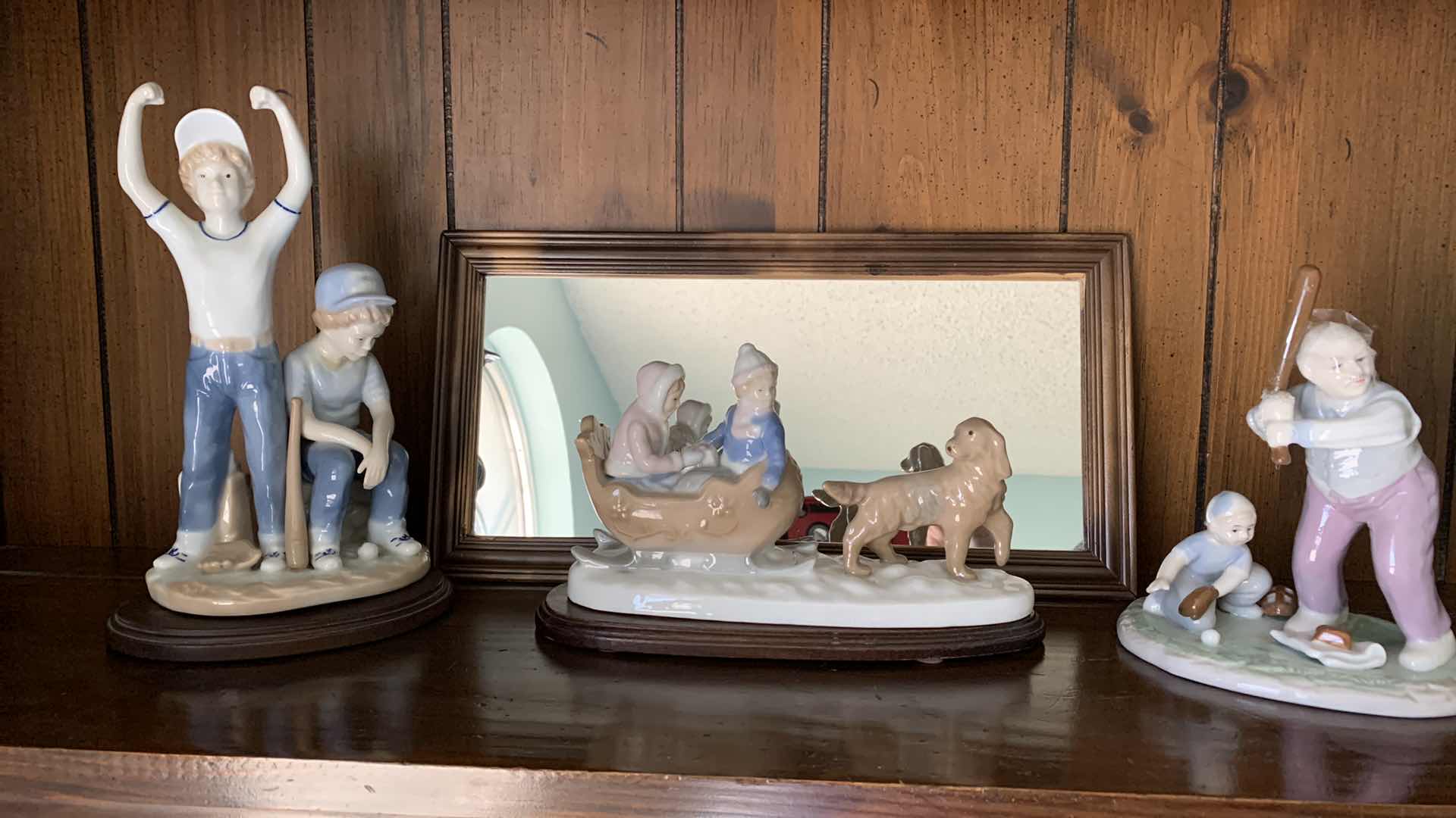 Photo 1 of PAUL SEBASTIAN PORCELAIN STATUES BASEBALL TALLEST IS 9”