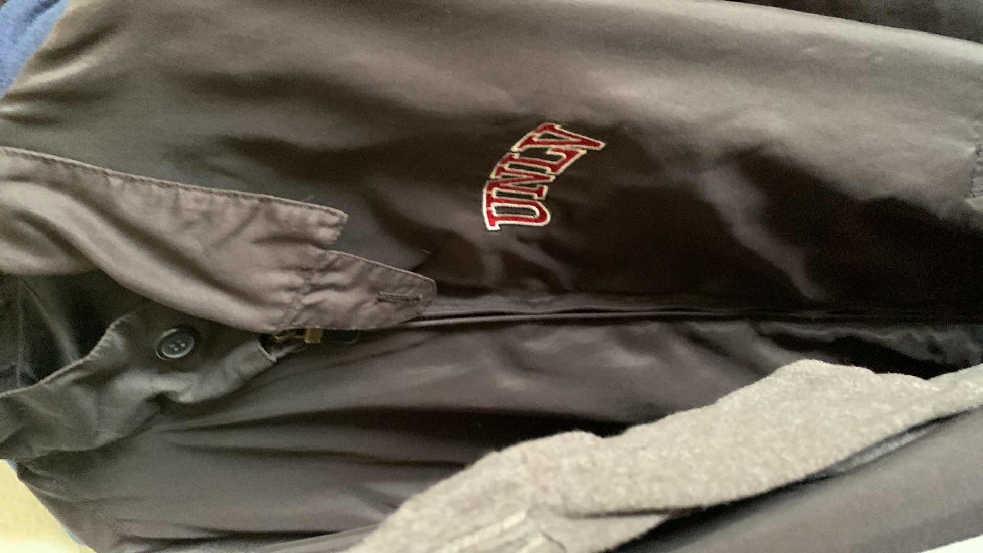 Photo 1 of CONTENTS OF CLOSET MENS AND WOMENS CLOTHING COLLECTION UNLV