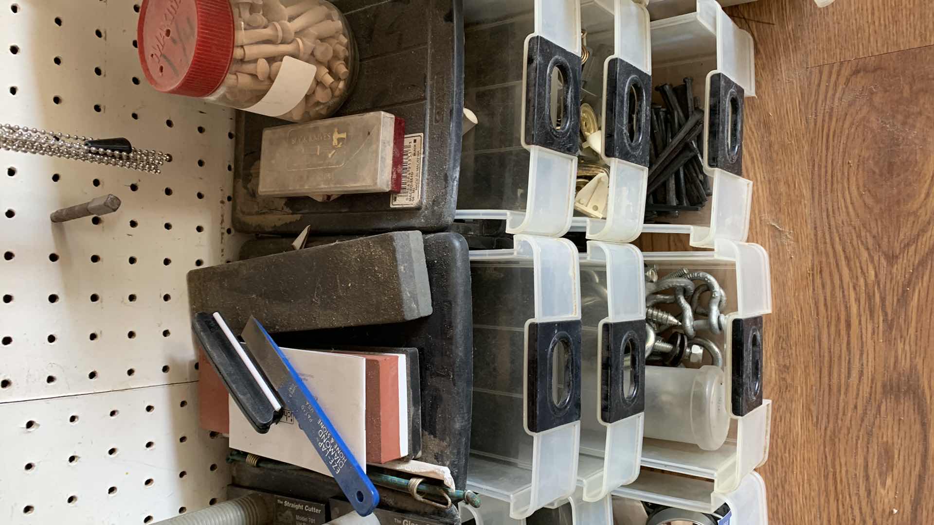 Photo 1 of CONTAINERS WITH HOUSE REPAIR ITEMS, GLASS CUTTERS, SHARPENING STONES