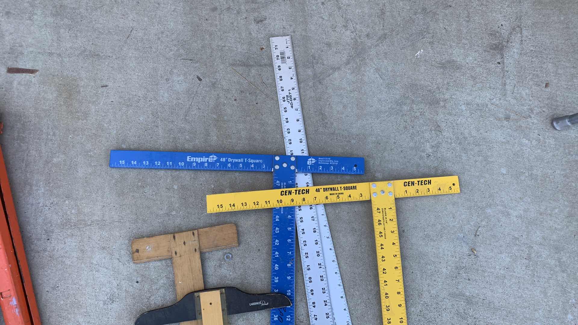 Photo 1 of ASSORTED DRYWALL T SQUARES AND METAL RULERS