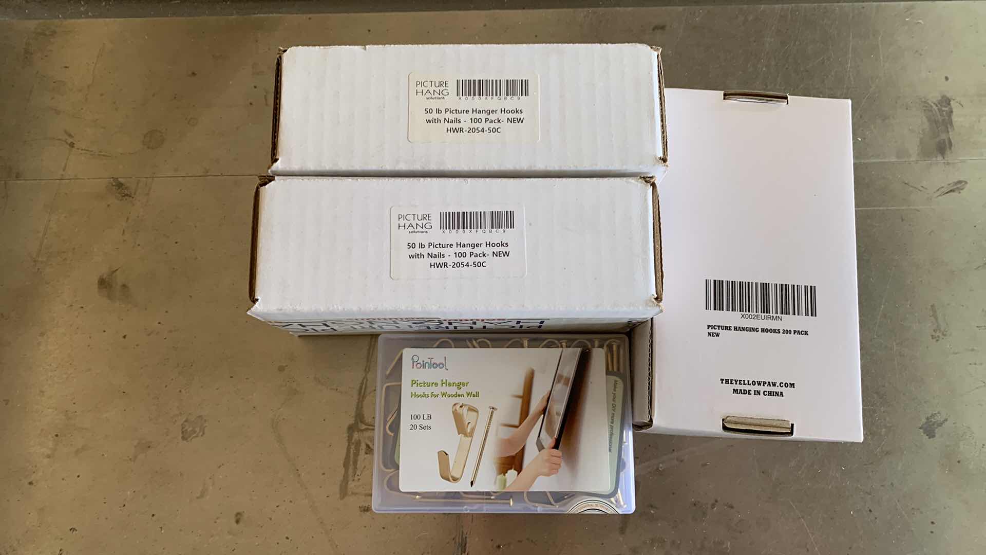 Photo 1 of FOUR BOXES OF PICTURE HANGING HOOKS FROM 50 UP TO 100 POUNDS