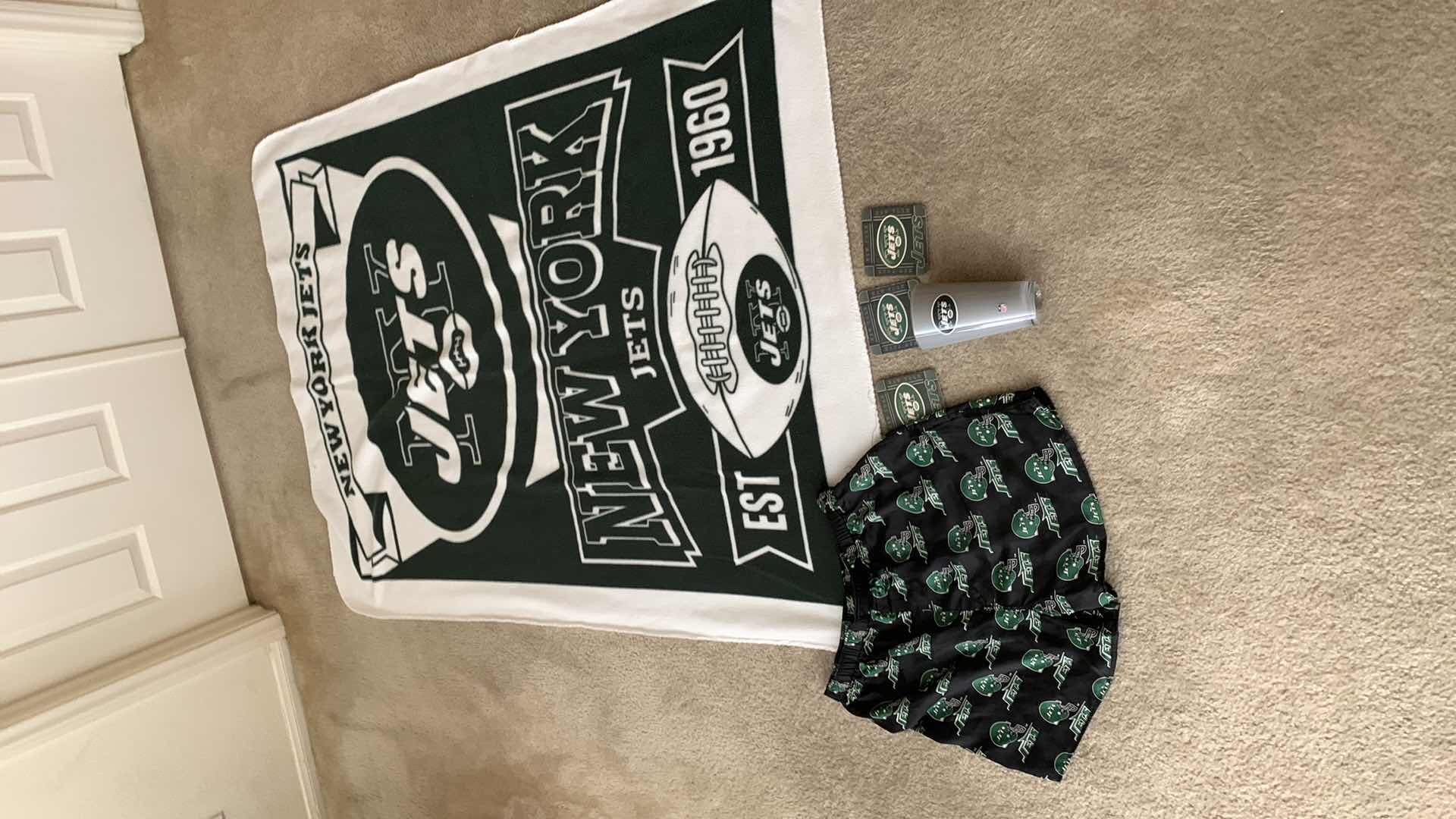 Photo 1 of NFL FOOTBALL BLANKET AND OTHER ITEMS