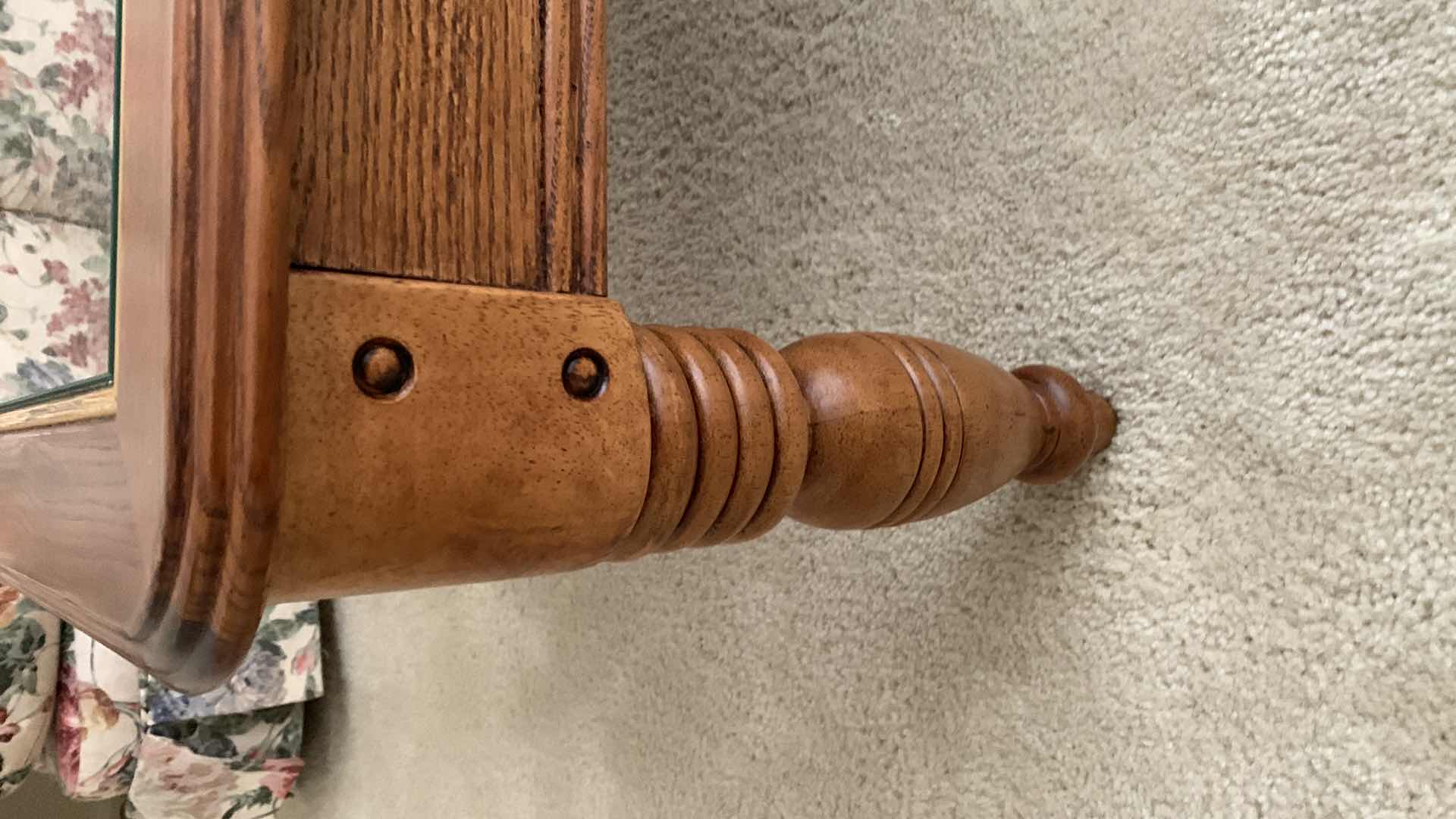 Photo 1 of GLASS TOPPED COCKTAIL TABLE 27” X 50” H  17” CANDLE INCLUDED