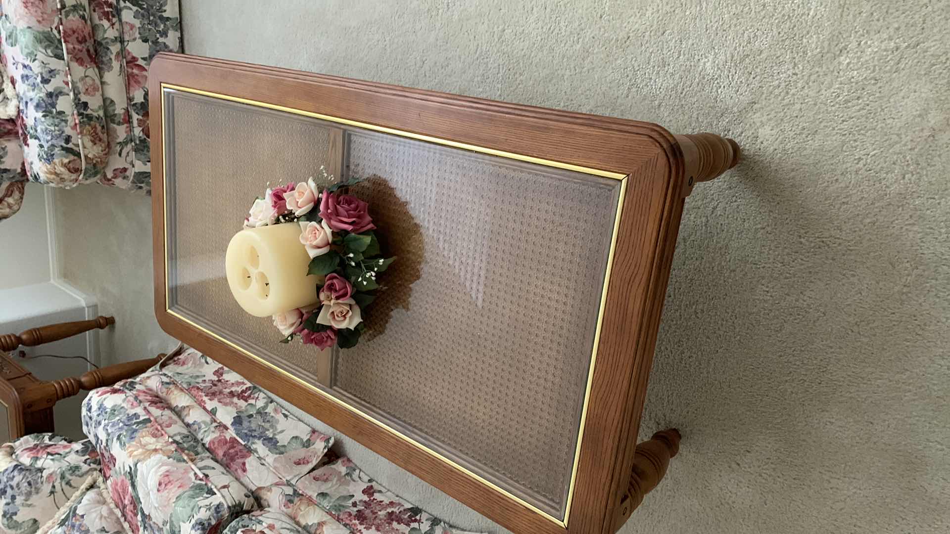 Photo 1 of GLASS TOPPED COCKTAIL TABLE 27” X 50” H  17” CANDLE INCLUDED