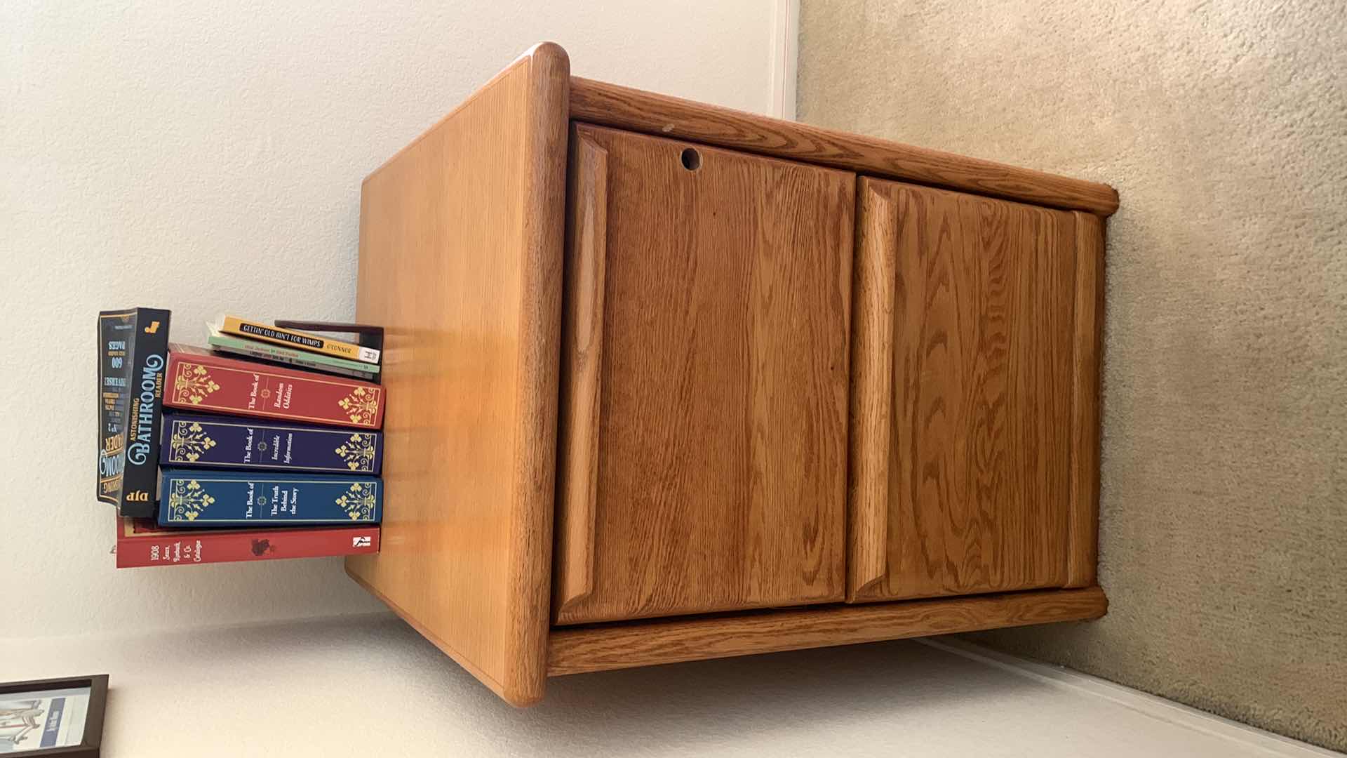 Photo 1 of WOODEN FILE CABINET 22” X 24” H 29” BOOKS INCLUDED, NO KEY