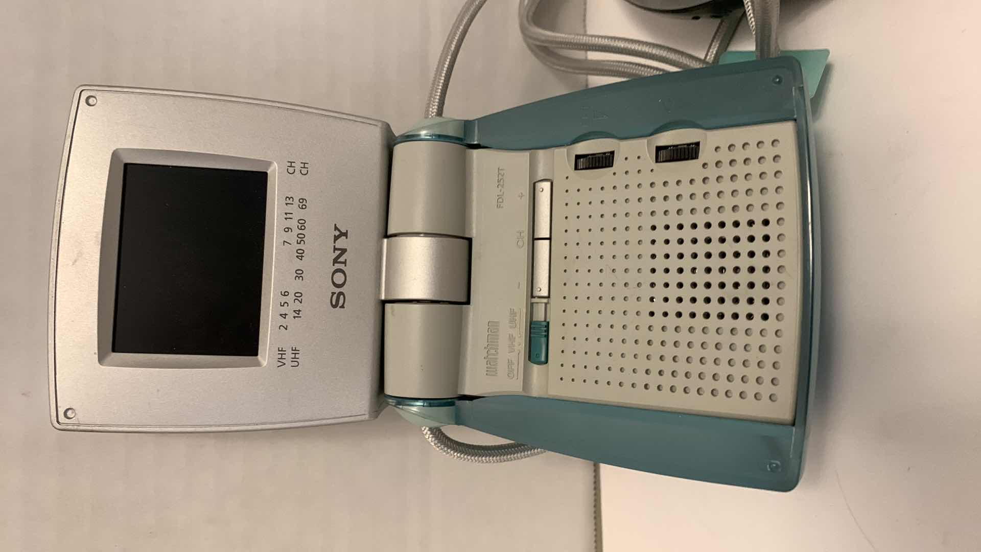 Photo 1 of SONY WATCHMAN 2.5” COLOR TELEVISION MODEL FDL-252T AND A SONY CD WALKMAN D-EJ011