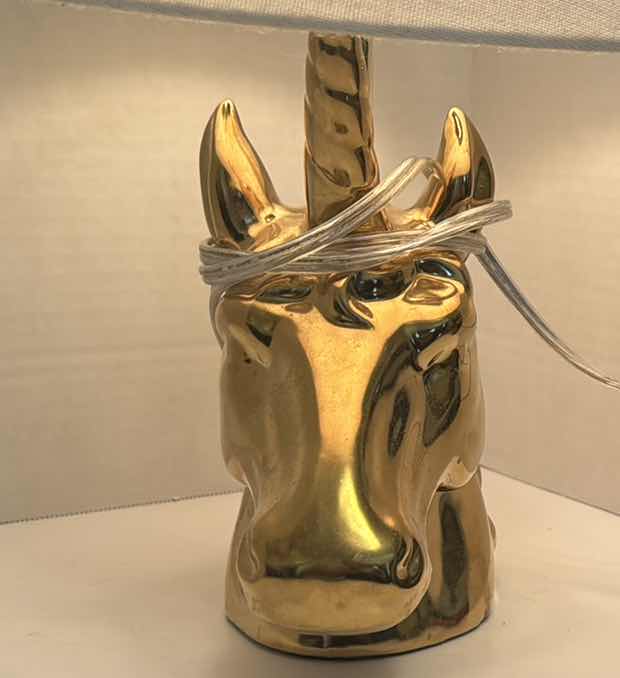 Photo 1 of GOLD UNICORN DESK LAMP
15.5”