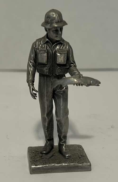 Photo 1 of METAL FIGURINES: SAND DOLLAR TIN, FISHERMAN, CANNON