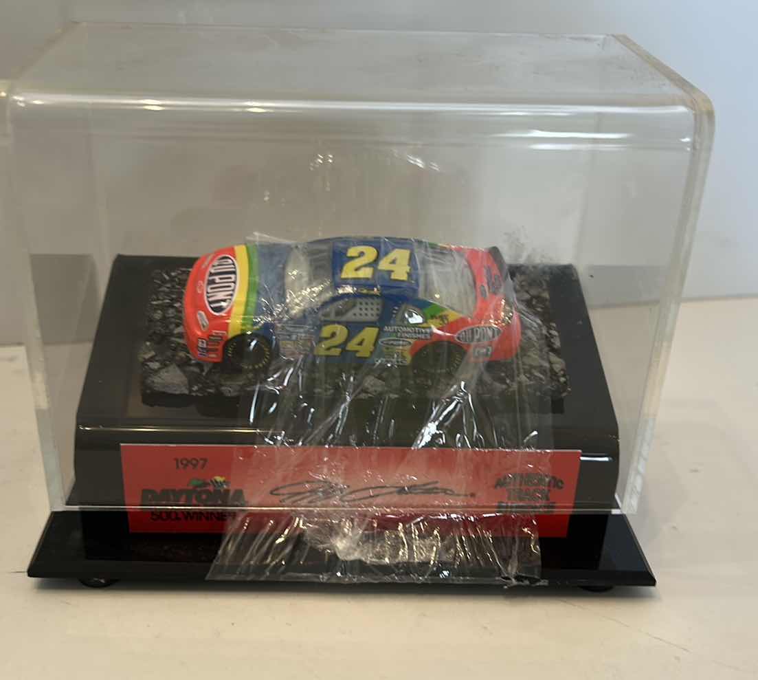 Photo 1 of COLLECTIBLE VINTAGE 1997 DAYTONA AUTHENTIC TRACK PIECE WITH COA AND CAR