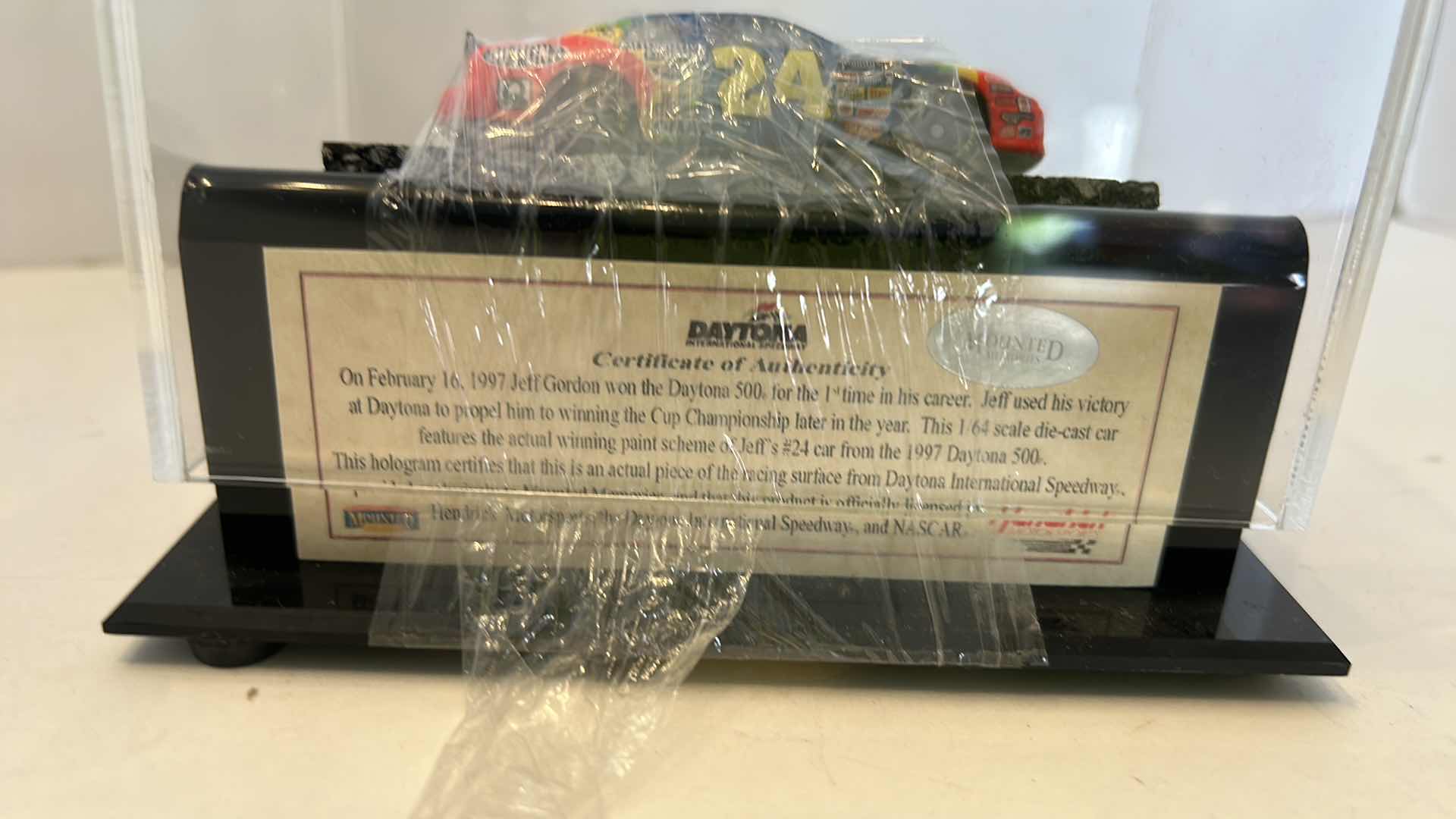 Photo 1 of COLLECTIBLE VINTAGE 1997 DAYTONA AUTHENTIC TRACK PIECE WITH COA AND CAR