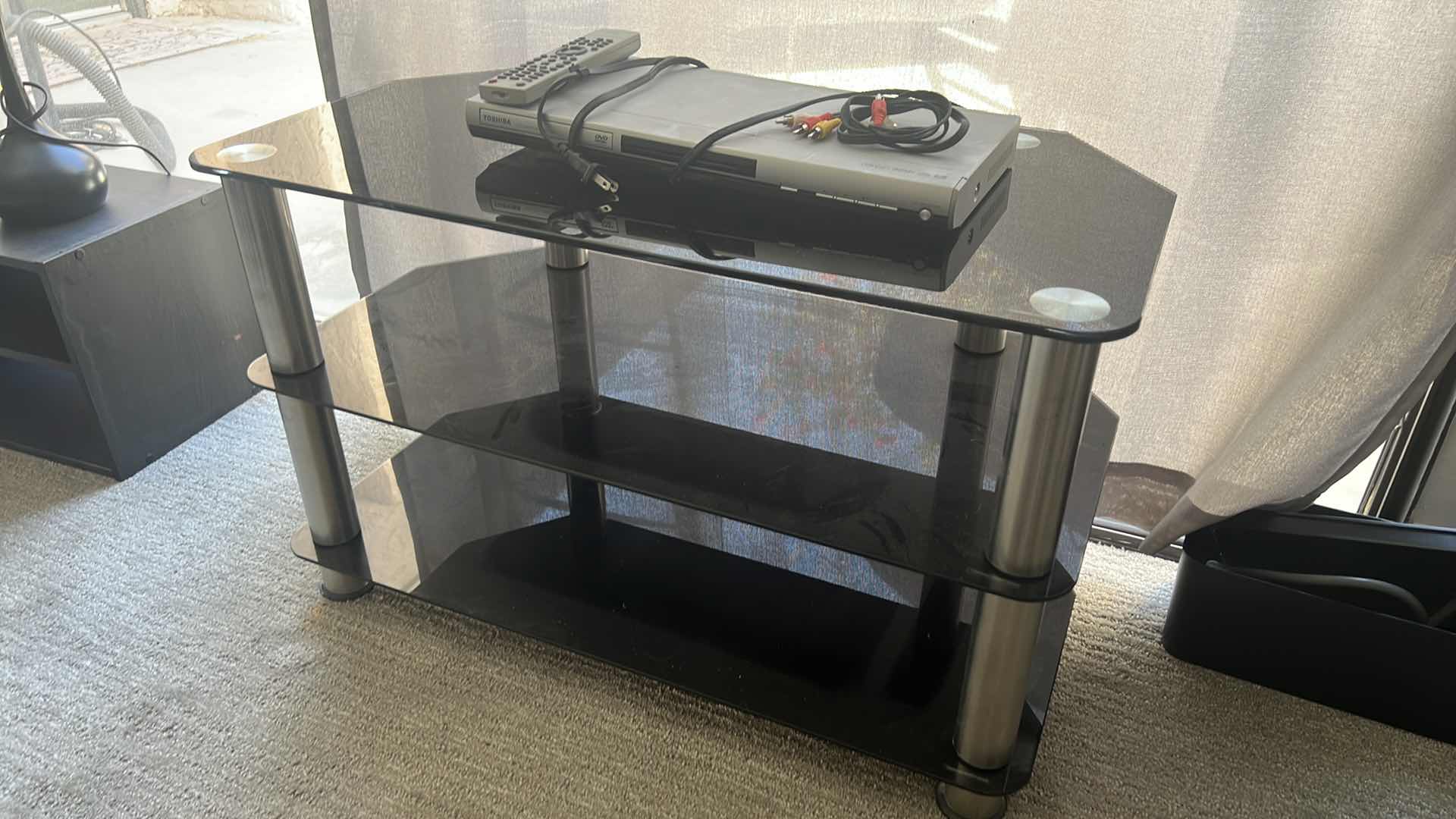 View 3 of SMOKED GLASS ENTERTAINMENT CENTER 32” x 17” H 20” W TOSHIBA DVD PLAYER & REMOTE